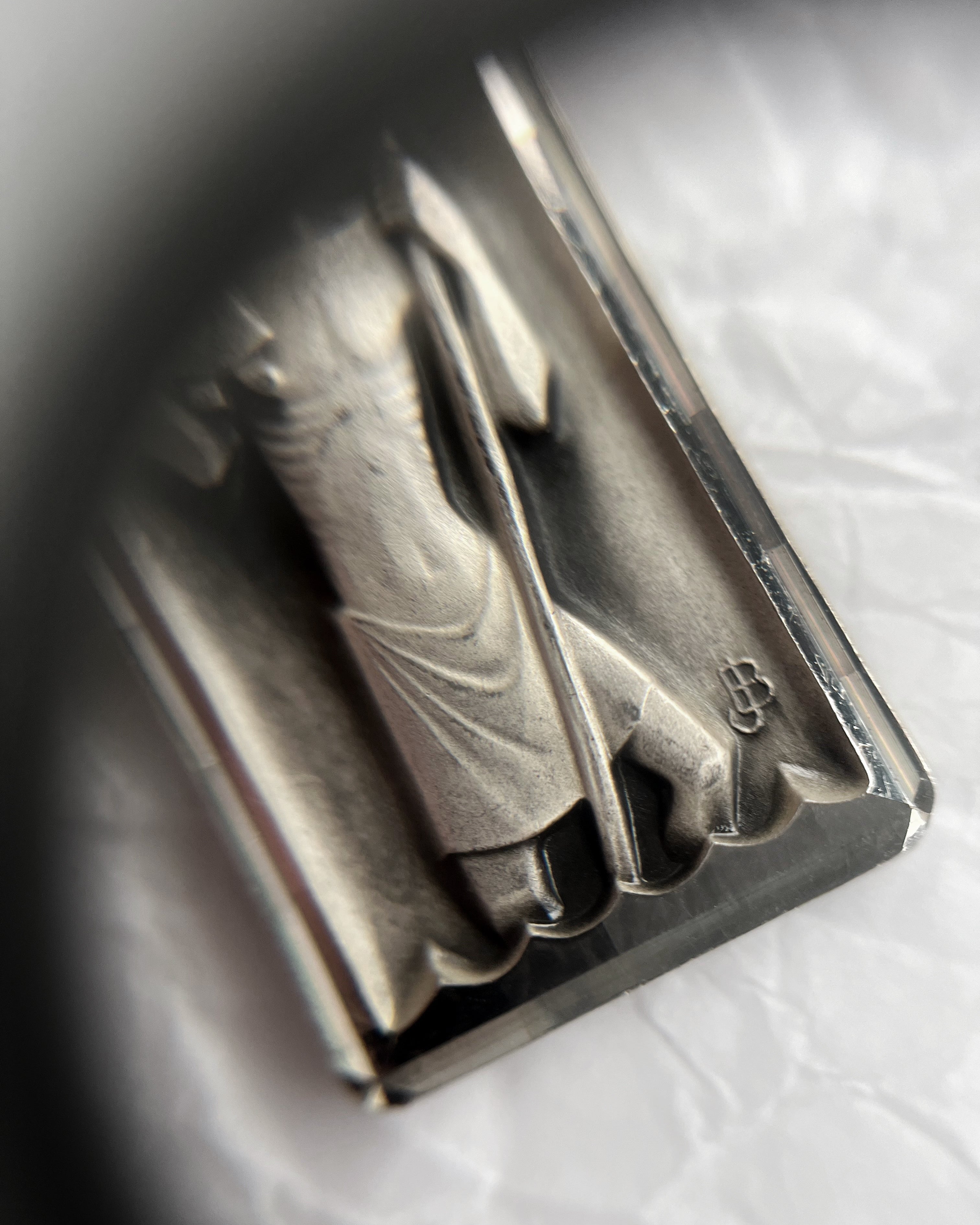 Close-up of mid century French St. Christopher pendant showing Jean Balme signature detail – Auric Vintage