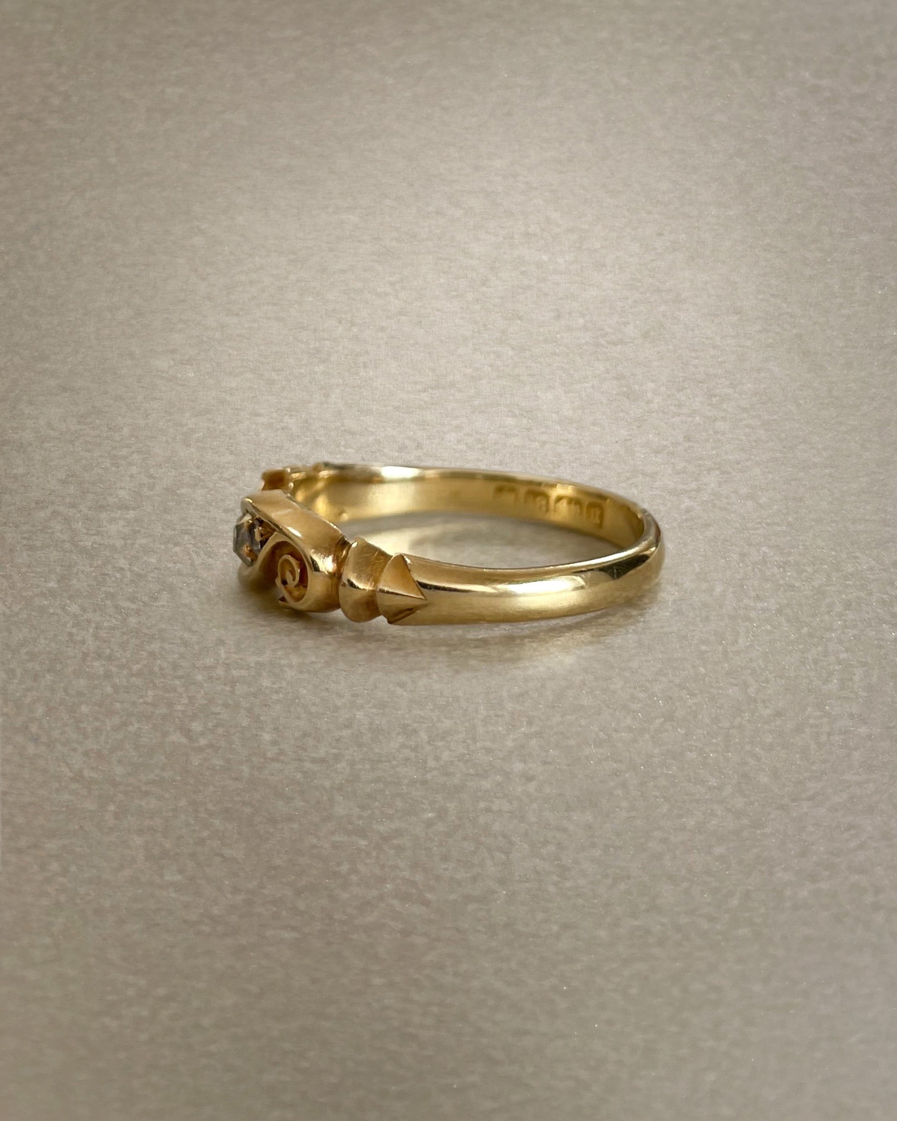 Side view of Victorian diamond three stone ring in 18kt yellow gold showing carved setting and solid shank – Auric Vintage