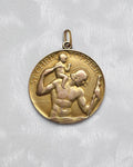 Vintage St. Christopher medal in 9kt gold by Paul Vincze with circular form and figural design – Auric Vintage