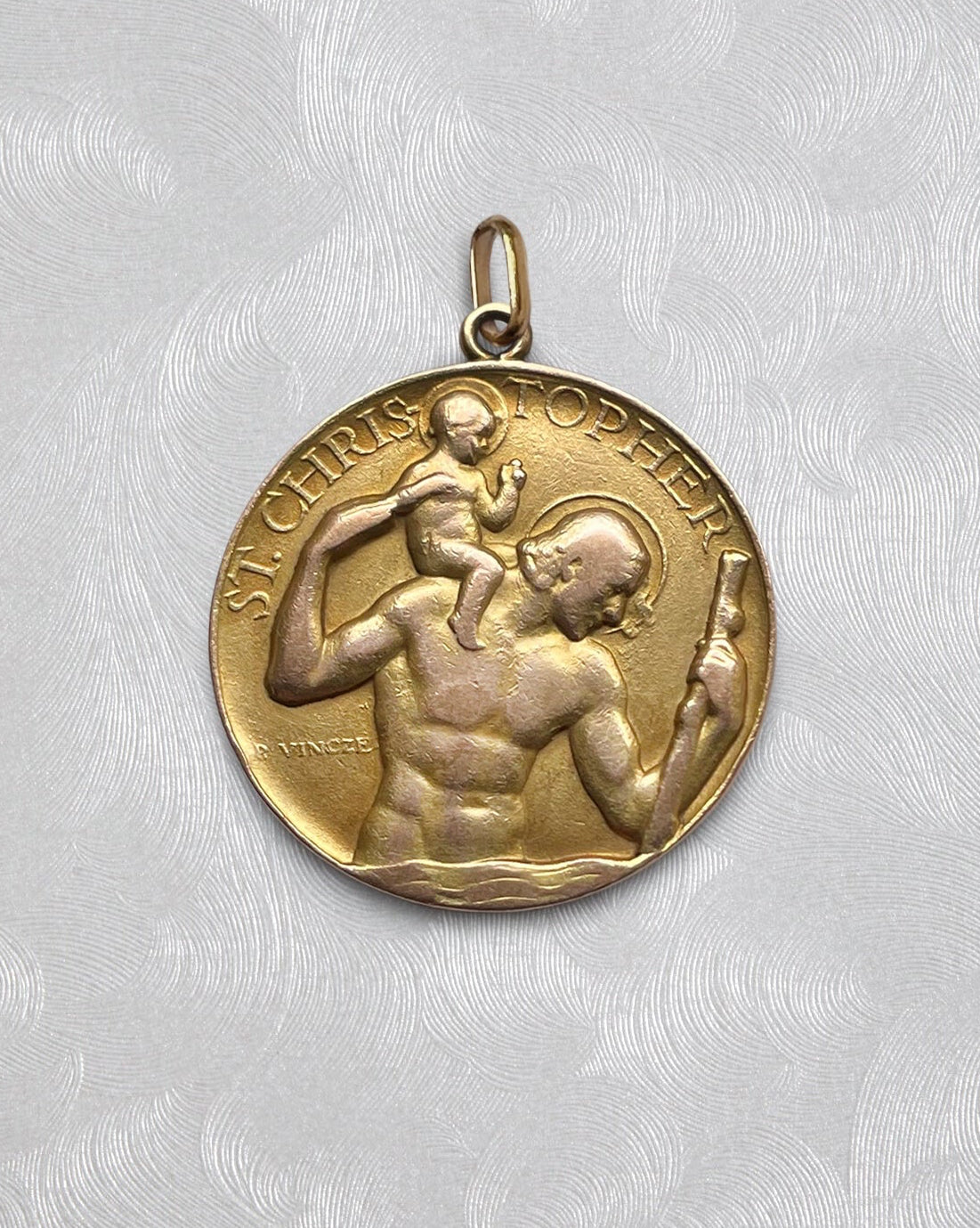 Vintage St. Christopher medal in 9kt gold by Paul Vincze with circular form and figural design – Auric Vintage