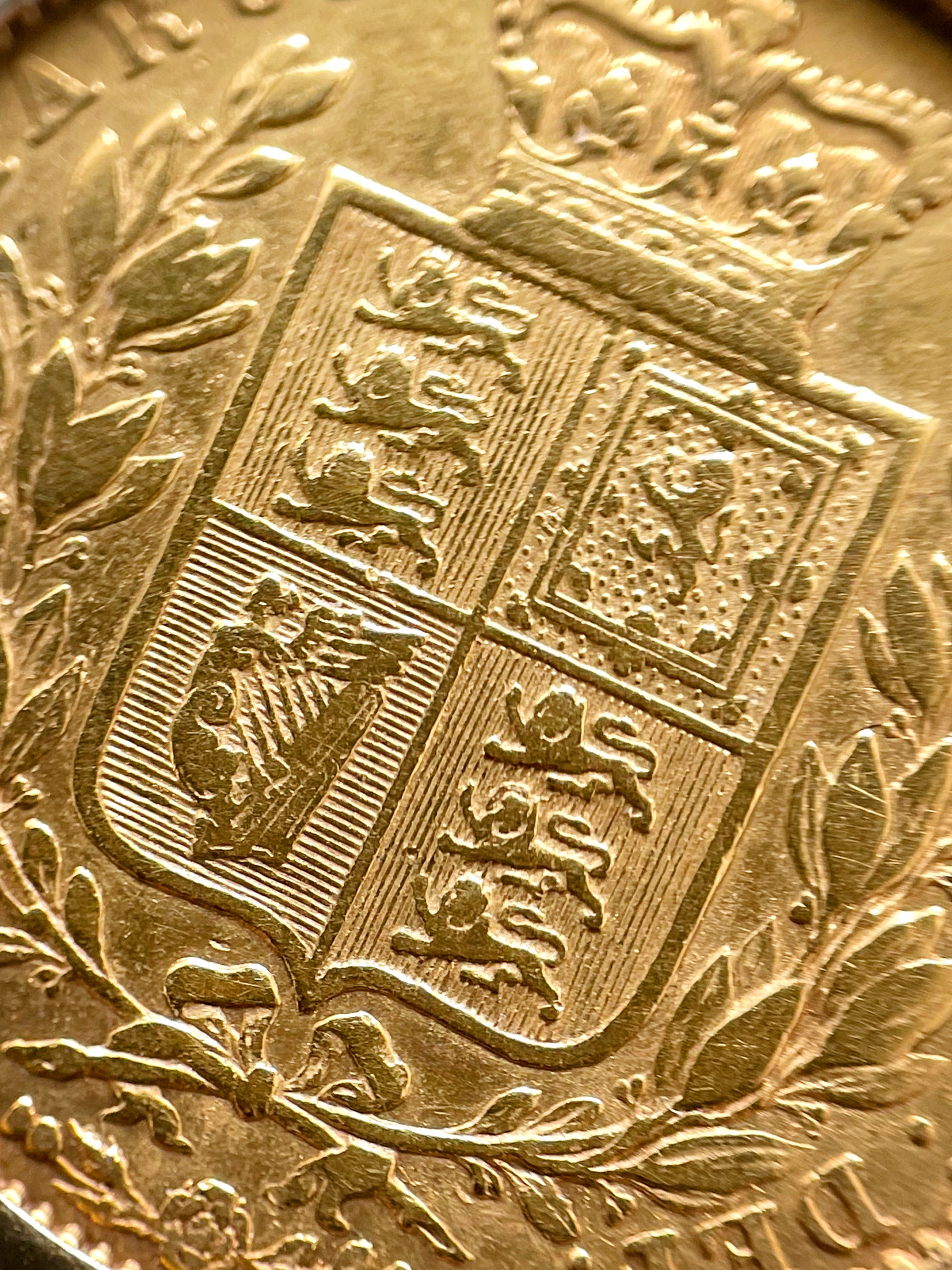 Close-up of antique gold sovereign bracelet showing shield sovereign reverse detail – Auric Vintage