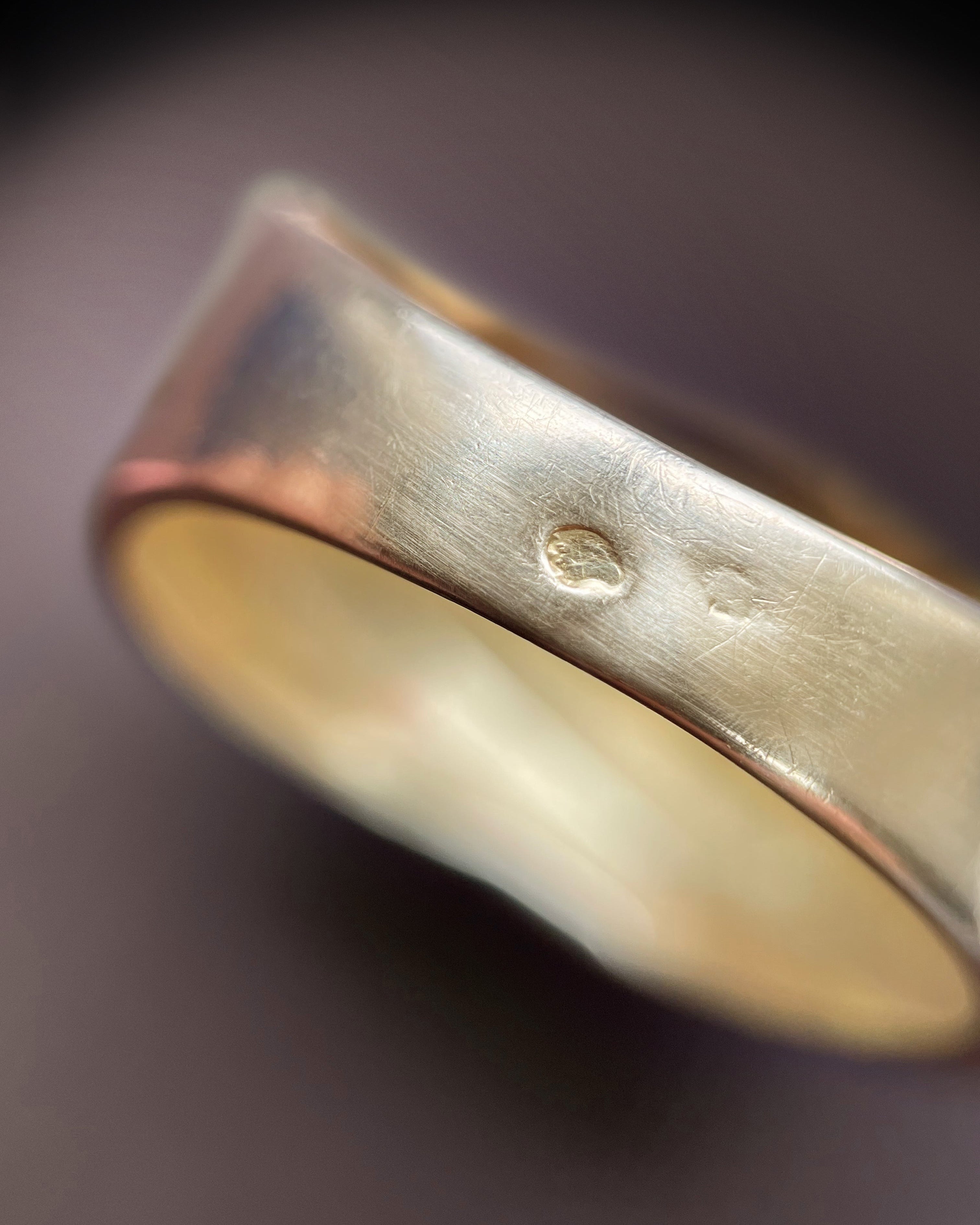 Close-up of 1980s French 18kt gold draped ring showing eagle’s head hallmark and maker’s mark – Auric Vintage