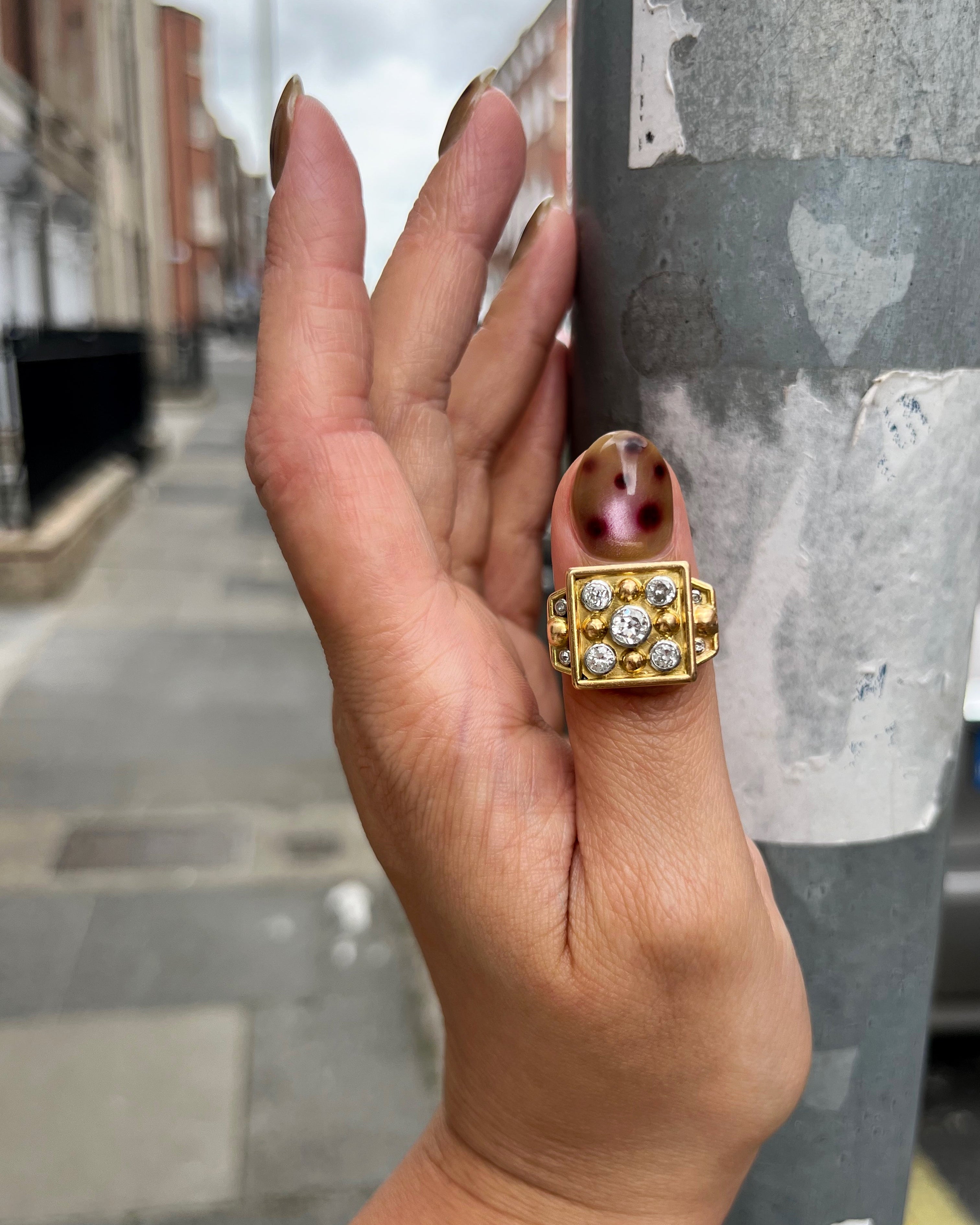 Retro French diamond ring in 18kt gold and platinum worn on hand showing bold square form – Auric Vintage