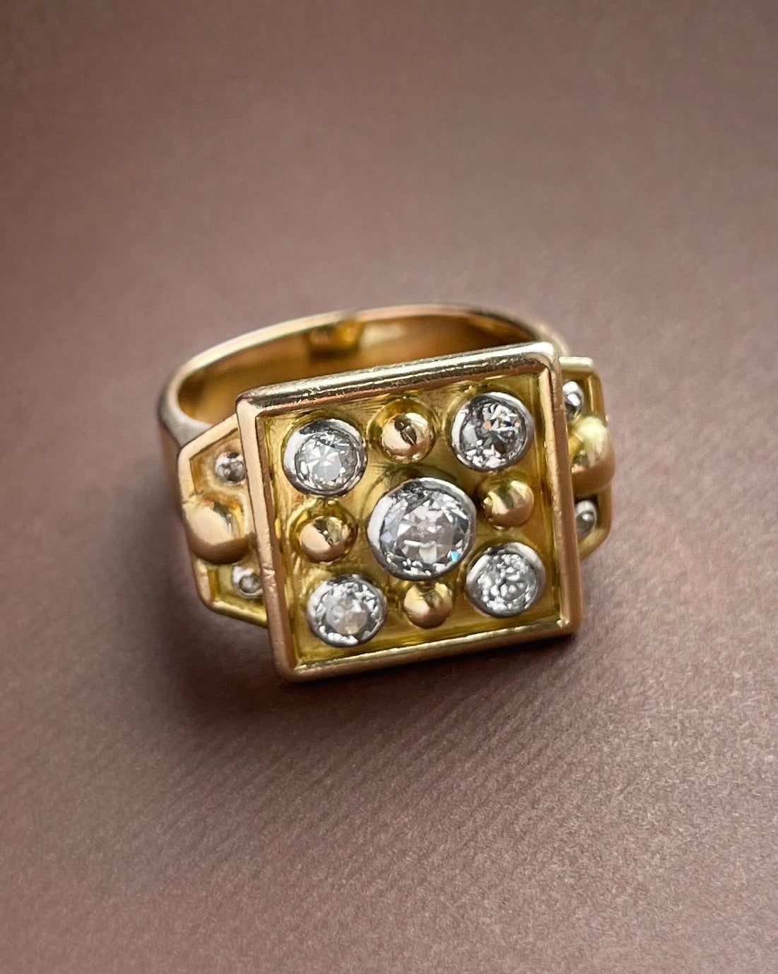 Side view of retro French diamond ring in 18kt gold and platinum showing raised setting and tapered shank – Auric Vintage
