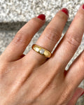 Victorian solitaire diamond ring in 18kt yellow gold worn on hand showing scale and old mine cut diamond – Auric Vintage