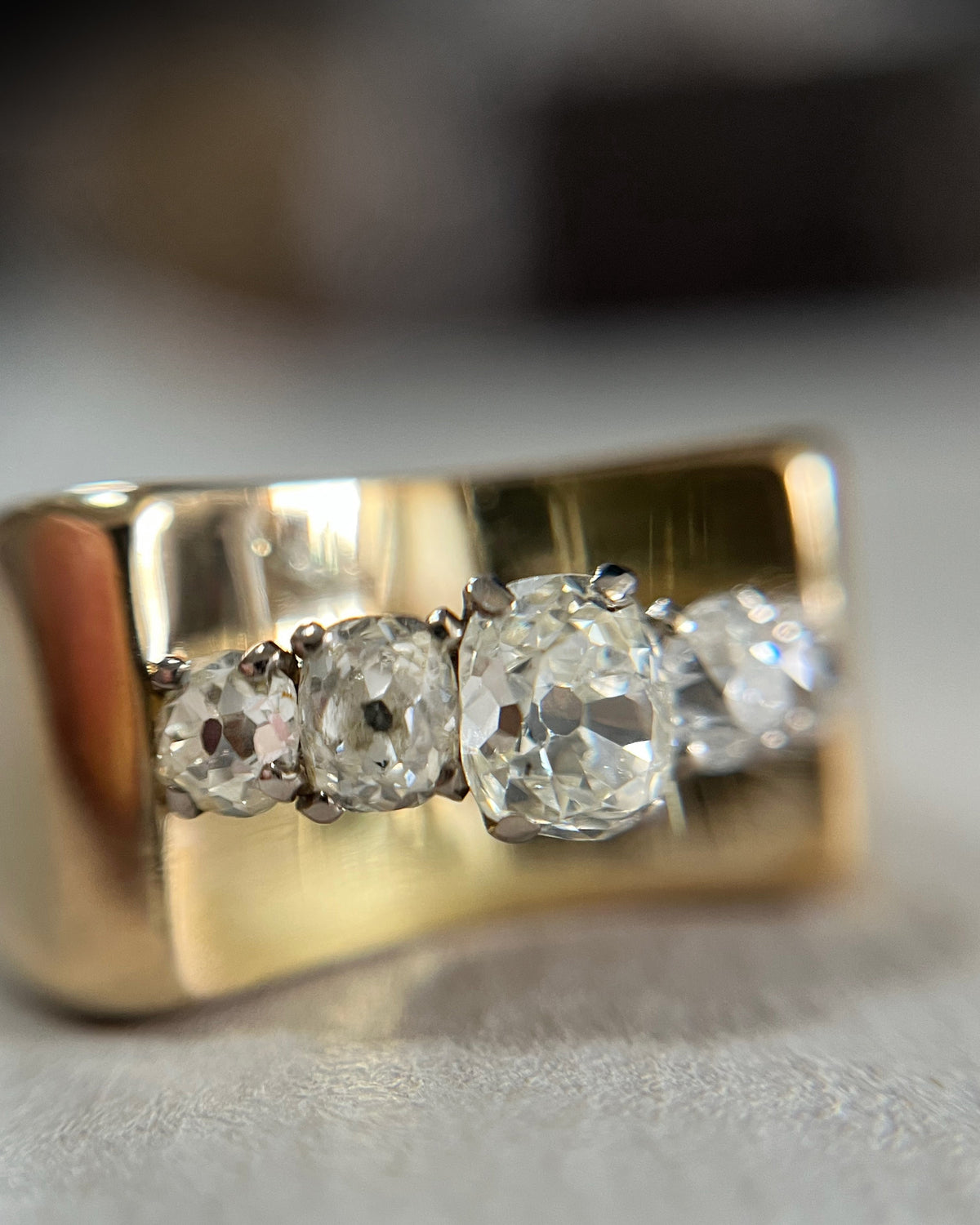Forties five stone diamond tank ring