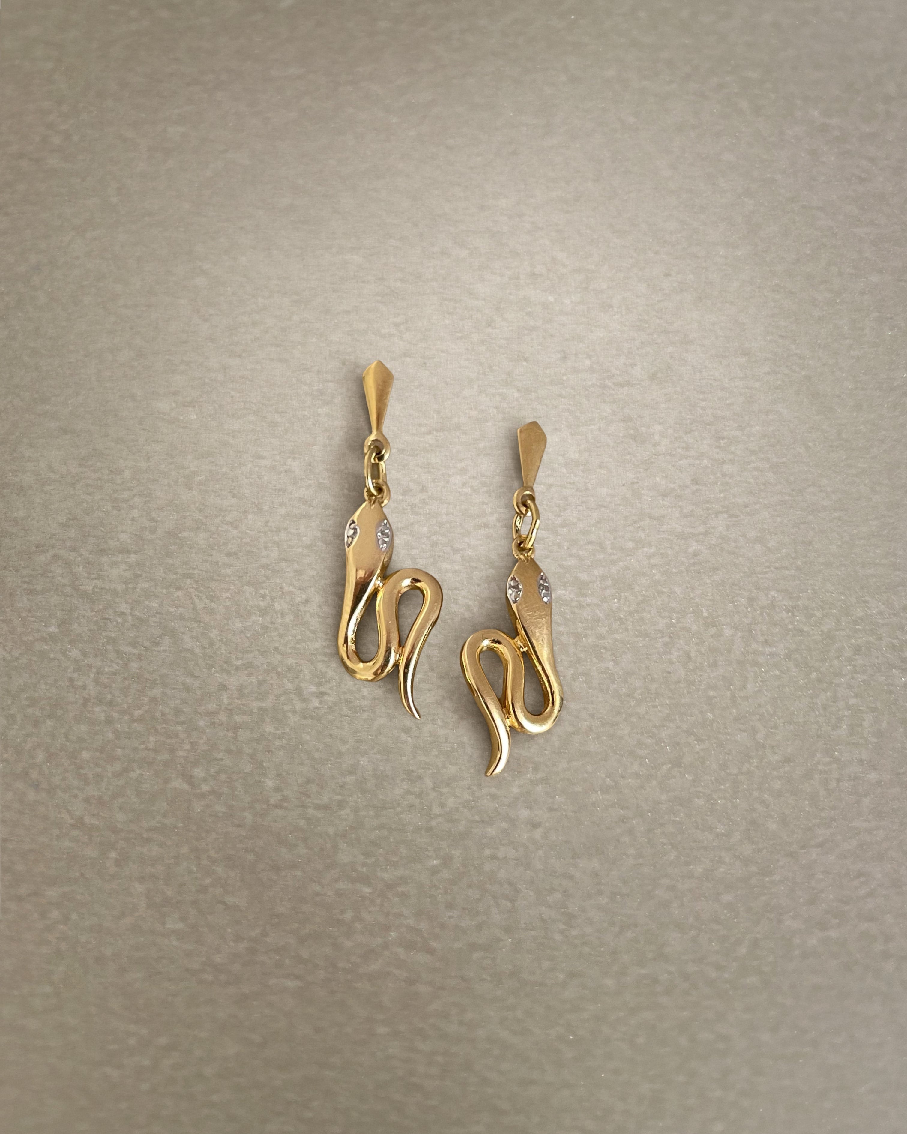 Contemporary twin serpent diamond drop earrings in 18kt yellow gold, front view – Auric Vintage