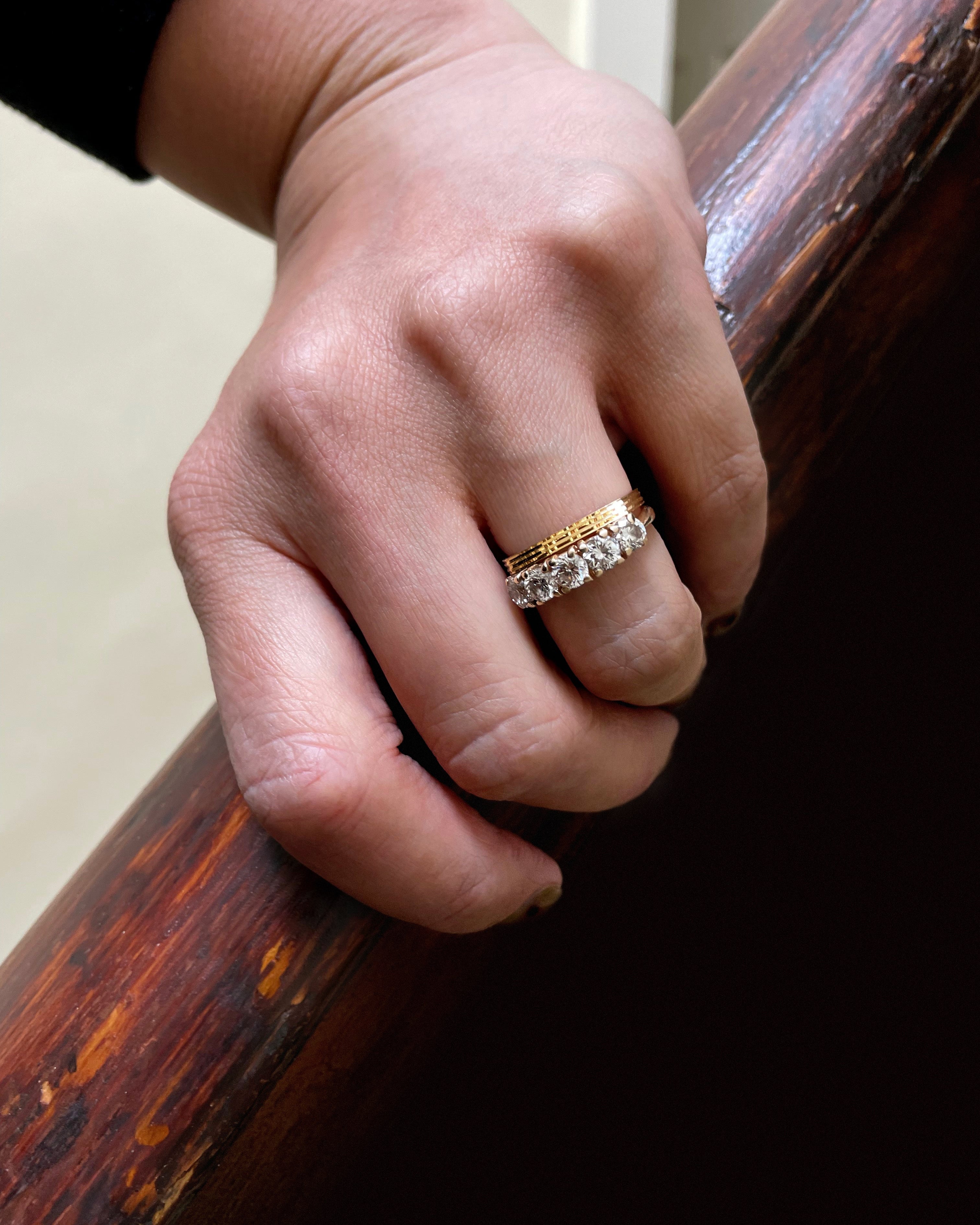 Noughties five stone diamond ring in 14kt yellow gold worn with wedding band showing diamond arrangement – Auric Vintage