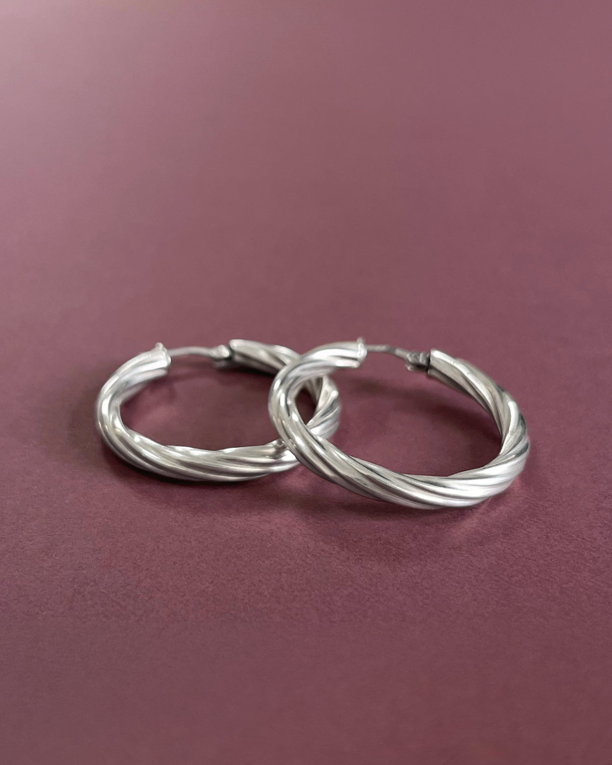 Nineties large twisted hoop earrings
