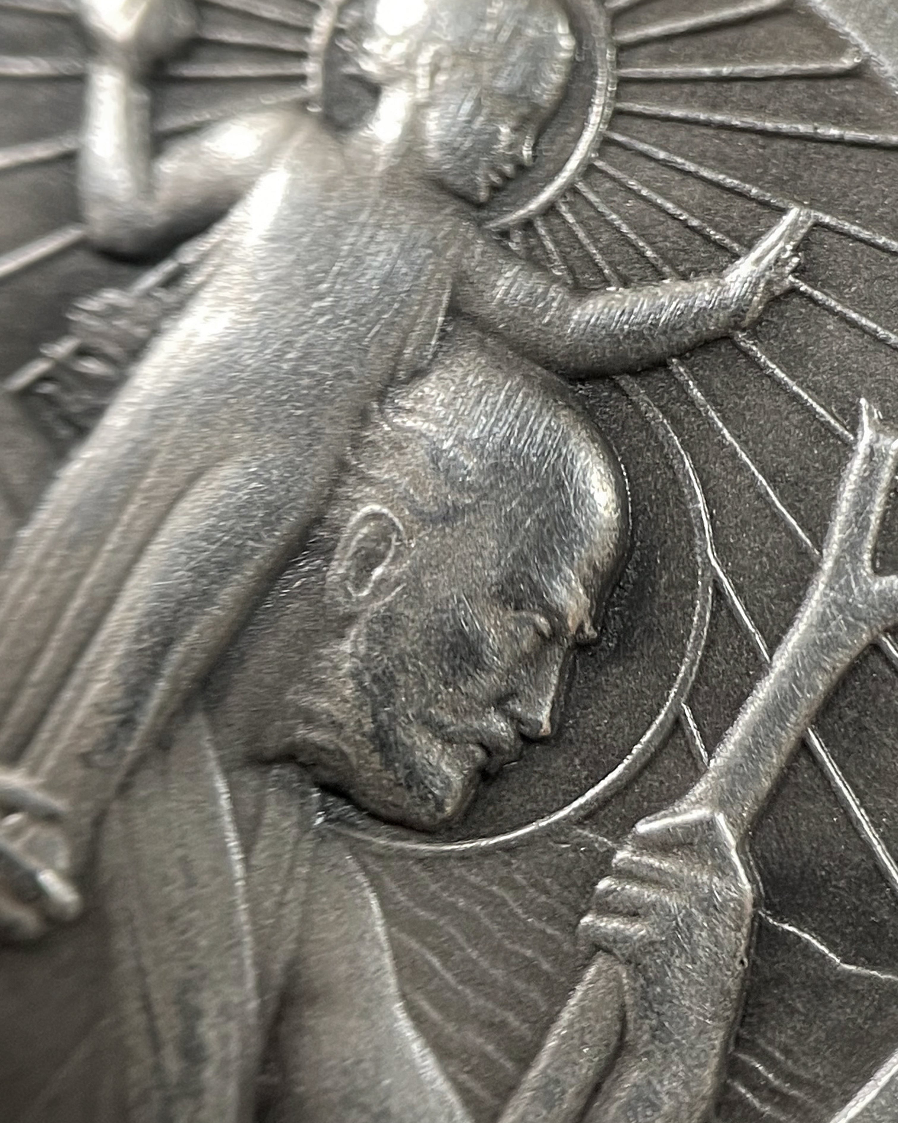 Close-up of vintage French silver St. Christopher pendant showing saint and Christ Child detail – Auric Vintage
