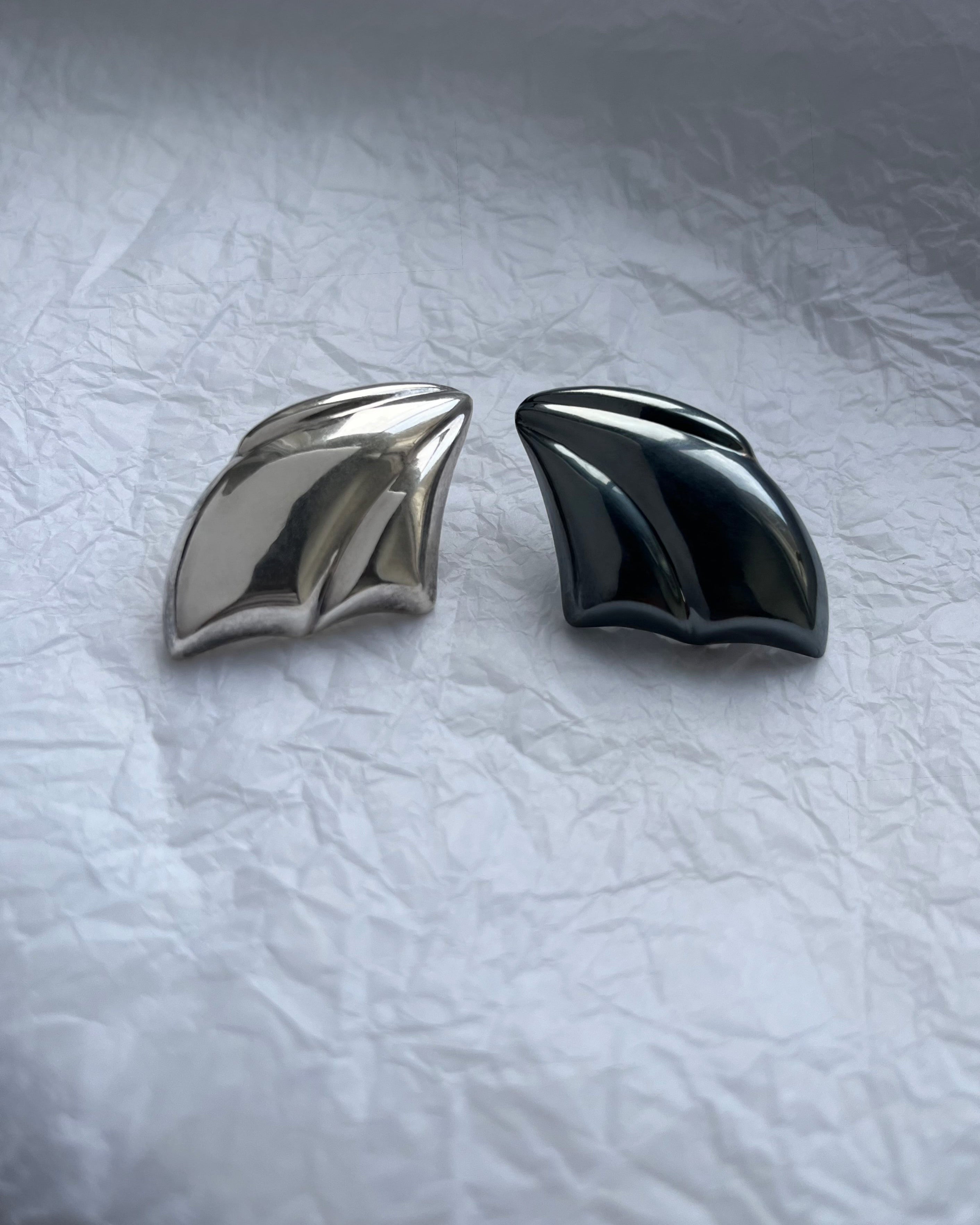 1980s Sterling silver sculptural draped earrings shown side by side highlighting form – Auric Vintage