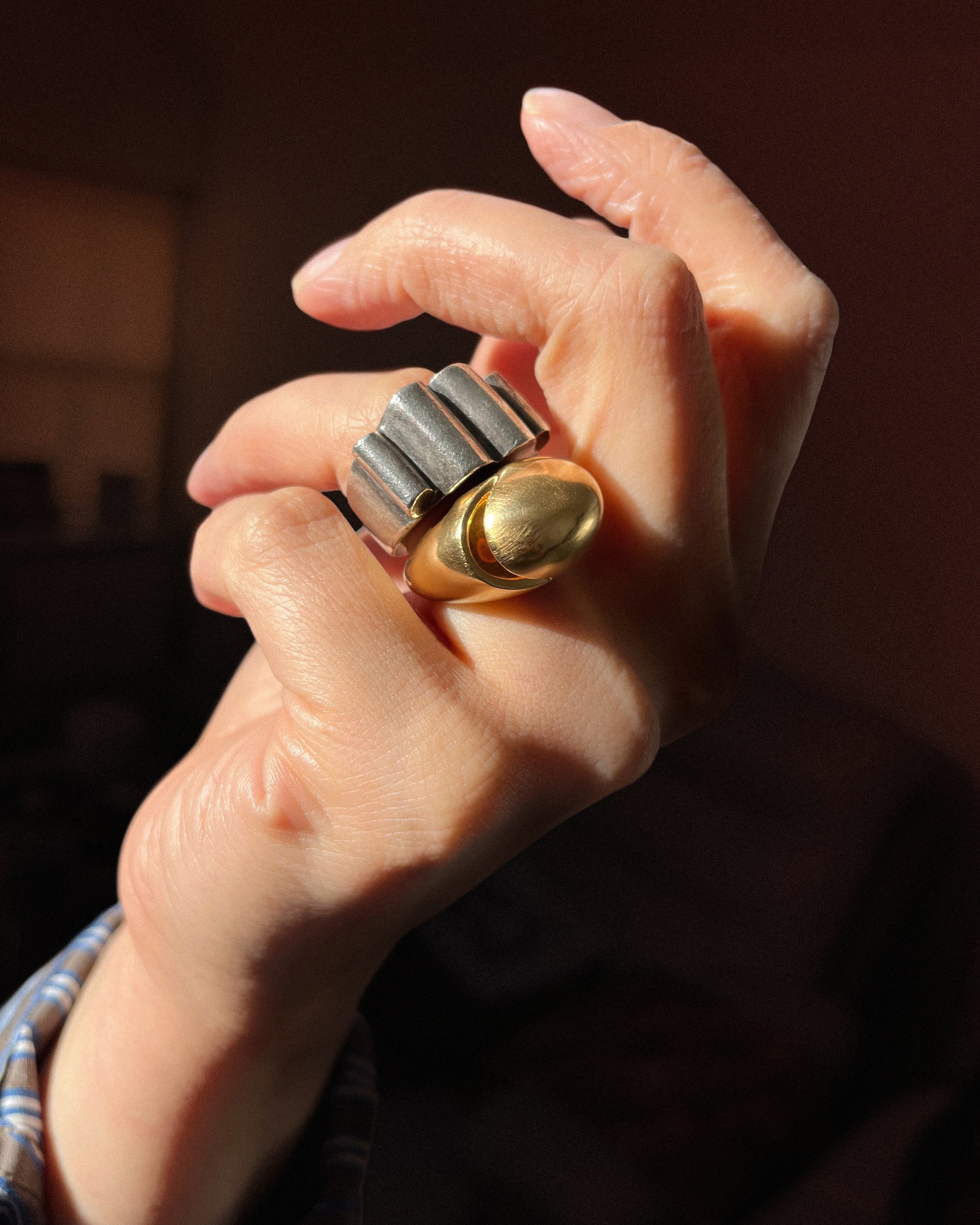 Sculptural brutalist quad-rib ring in solid silver worn stacked with Bvlgari cabochon ring in 18kt yellow gold – Auric Vintage