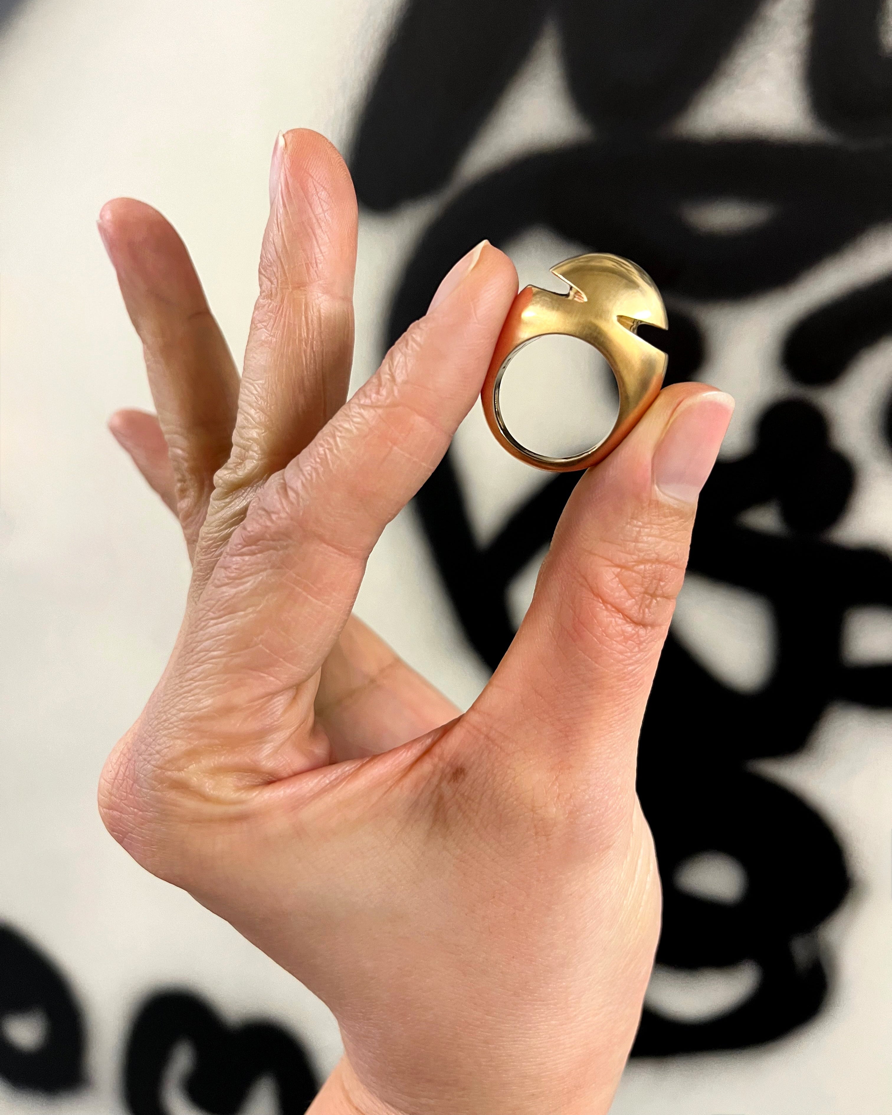 Vintage Bvlgari cabochon ring in 18kt yellow gold held in hand showing scale and polished finish – Auric Vintage