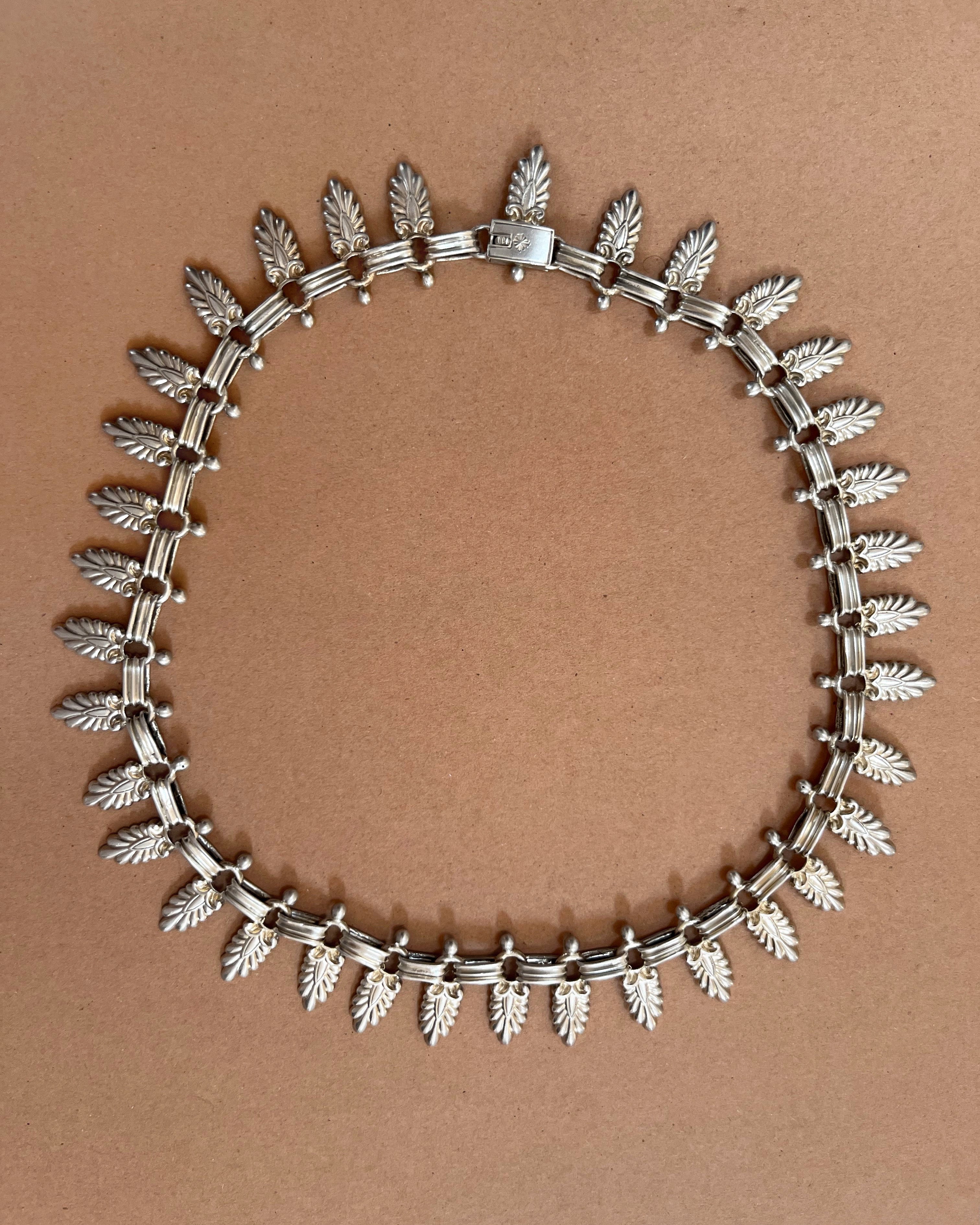 Antique Sterling silver Cleopatra collar necklace with articulated palm leaf design, top view – Auric Vintage