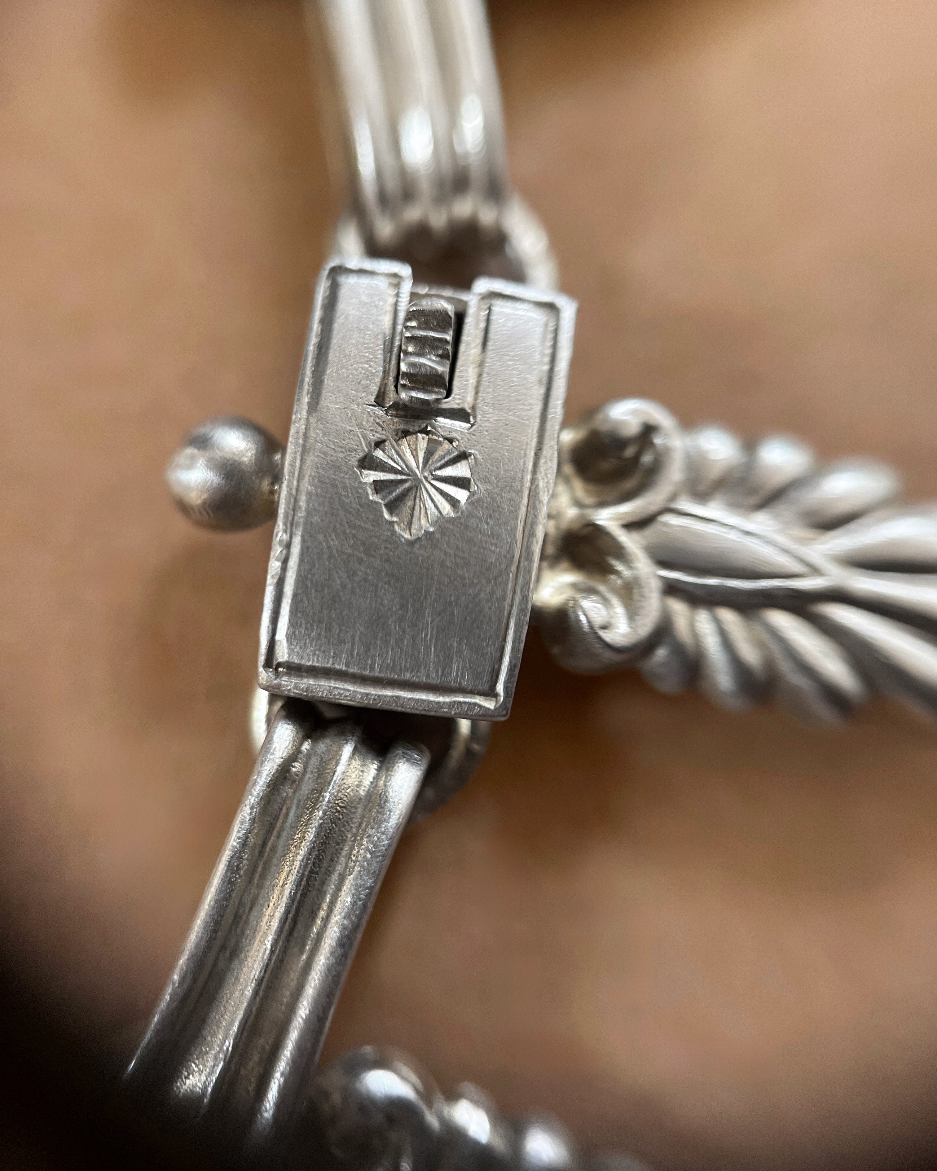 Close-up of push clasp on antique Sterling silver Cleopatra collar necklace – Auric Vintage