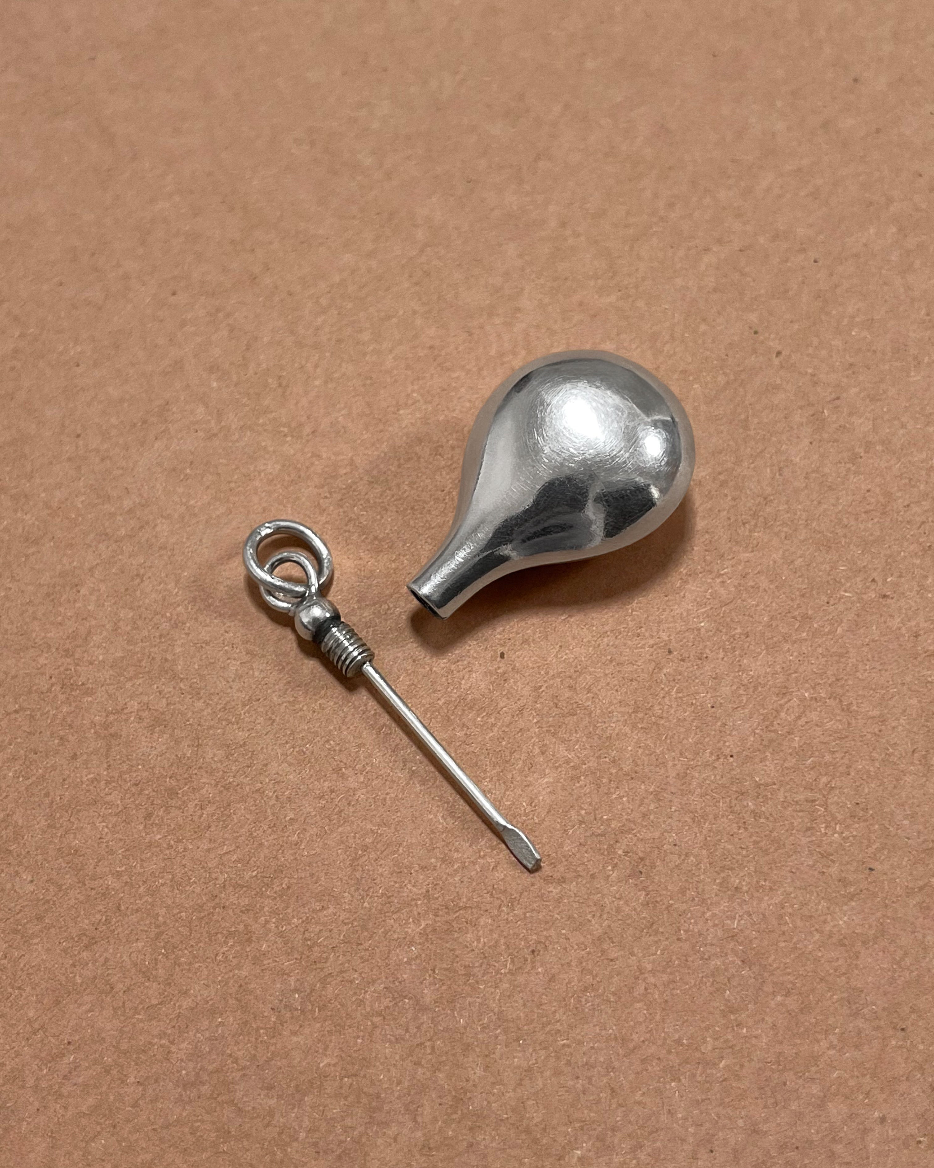 1980s Sterling silver vessel pendant opened to reveal screw-top construction, top view – Auric Vintage