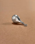 Side view of 1980s Sterling silver vessel pendant showing sculptural teardrop profile – Auric Vintage