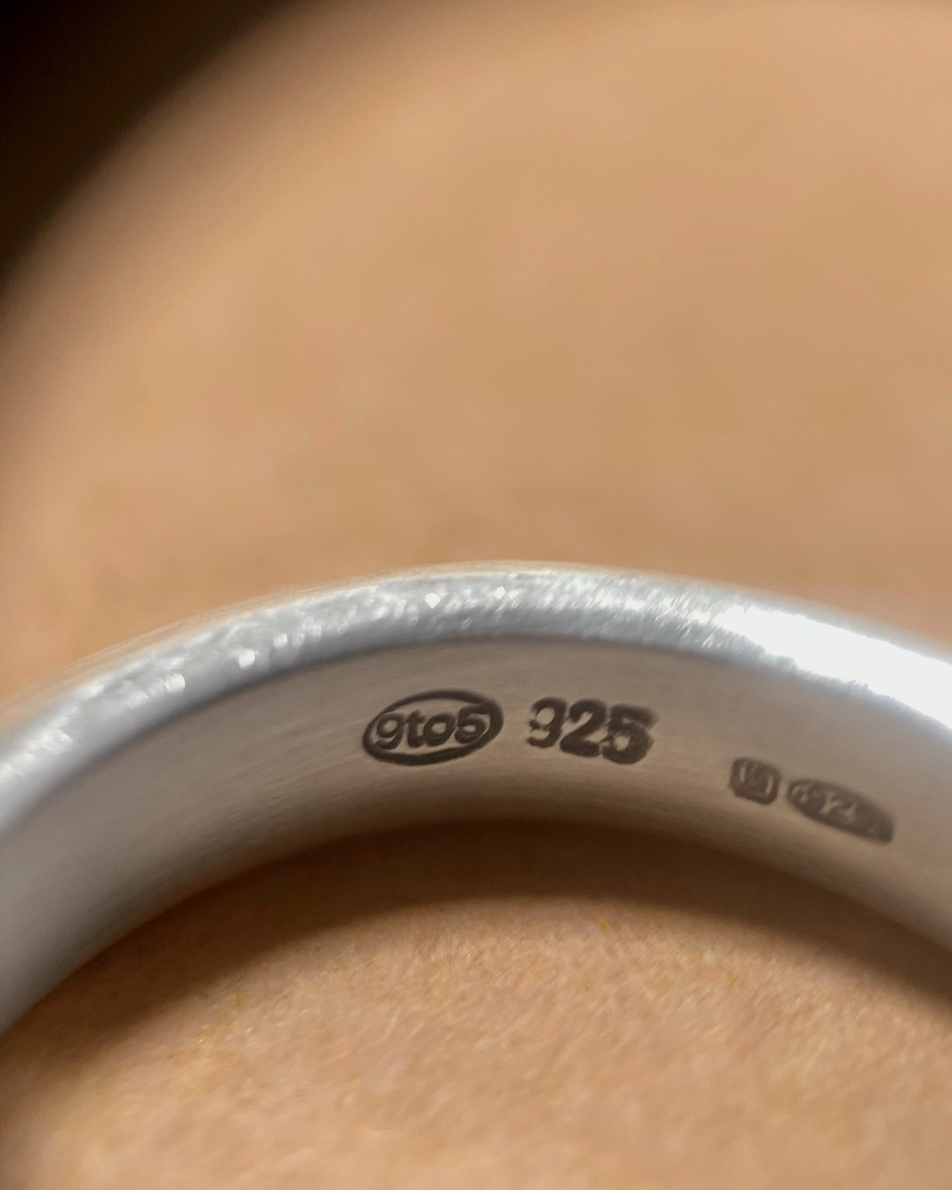 Close-up of 925 hallmark inside vintage chunky knife-edge Sterling silver ring – Auric Vintage