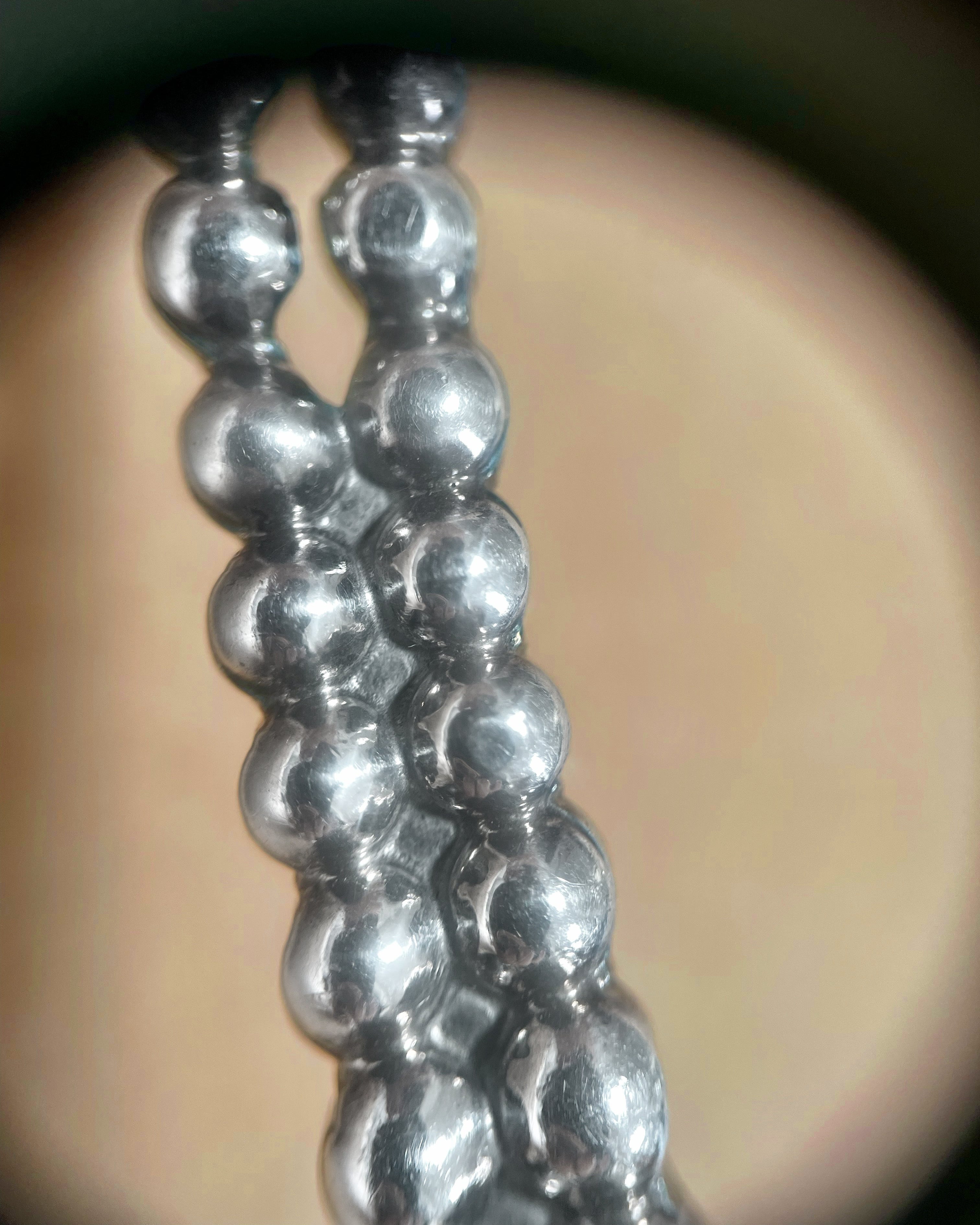 Close-up of three-dimensional bubble pattern on Y2K Sterling silver torque collar – Auric Vintage