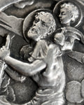 Magnified detail of 1960s French 800 silver St Christopher pendant showing St Christopher, Christ Child, turbulent waters and clouded sky