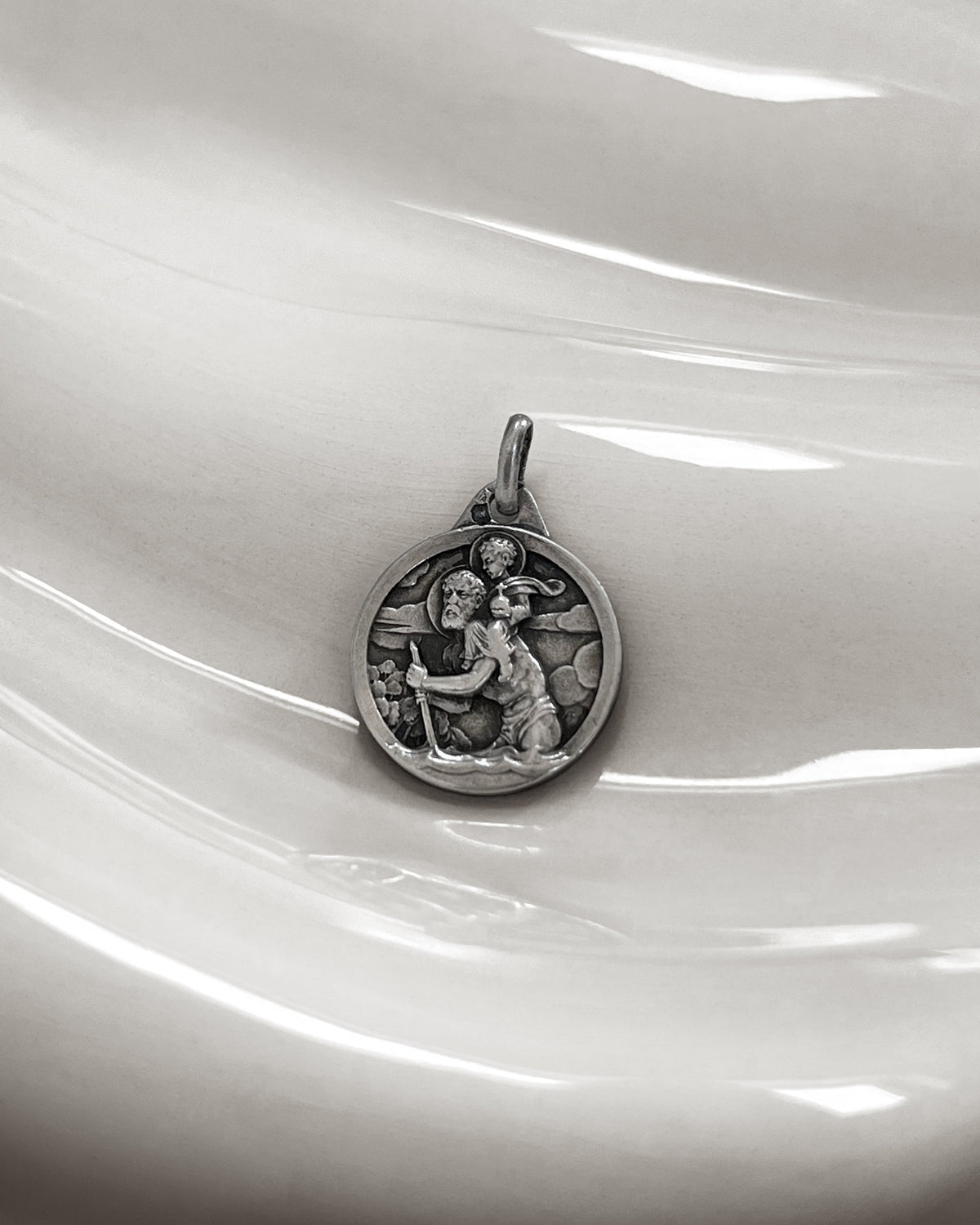 1960s French vintage 800 silver St Christopher pendant depicting the saint carrying Christ Child through turbulent waters