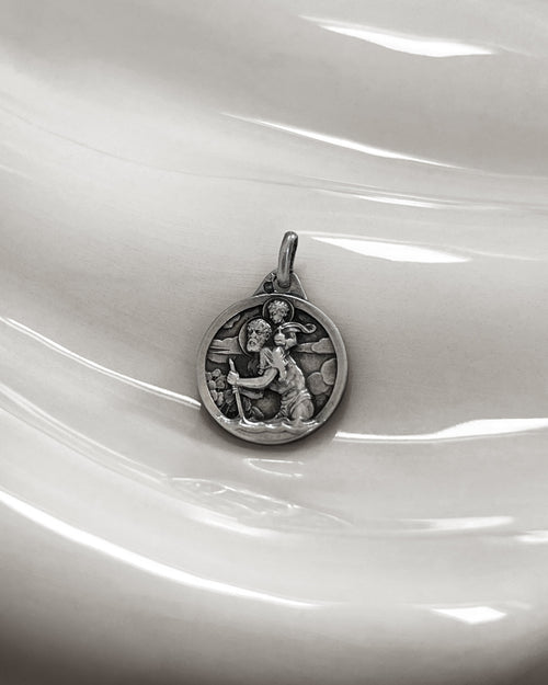 1960s French vintage 800 silver St Christopher pendant depicting the saint carrying Christ Child through turbulent waters