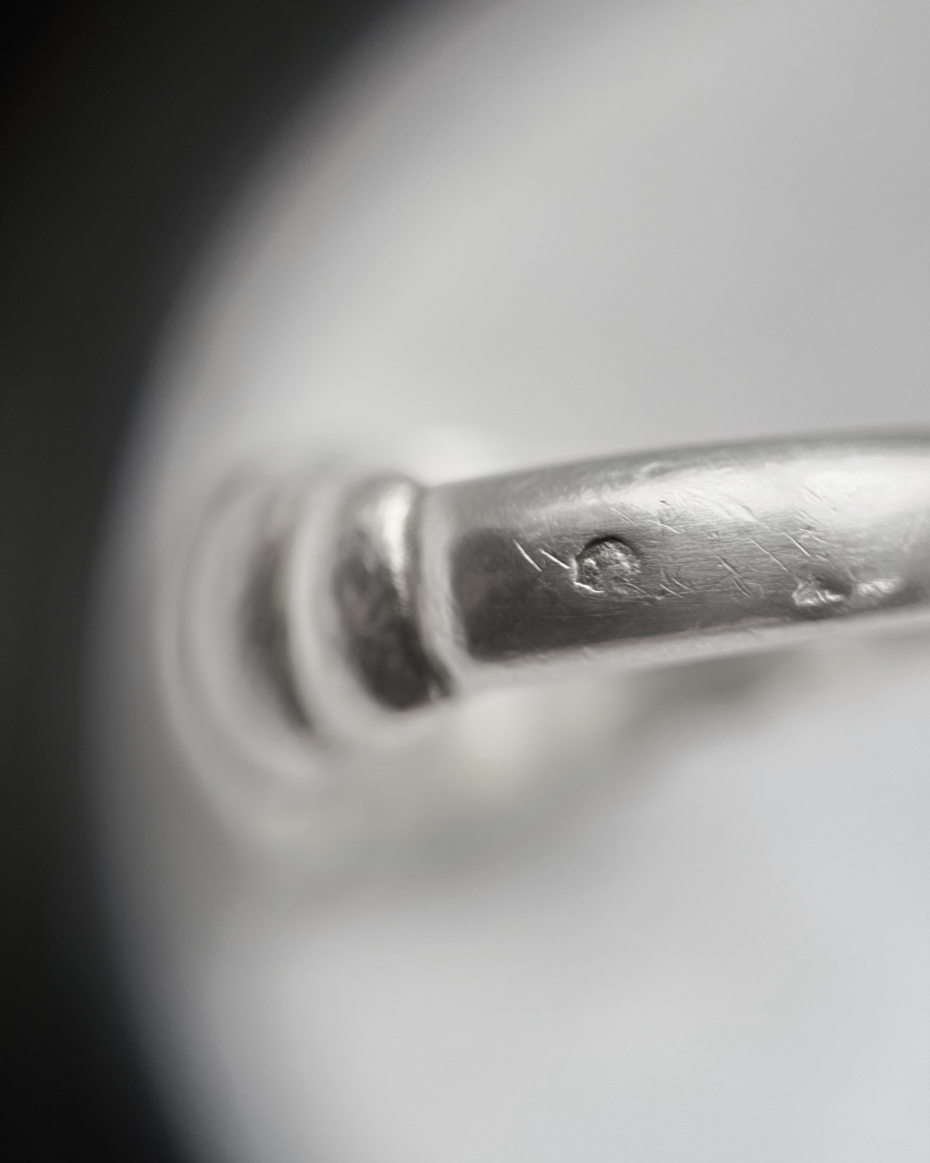 Close-up of 1950s French sterling silver ribbed bombé ring showing French silver hallmark on shank – Auric Vintage