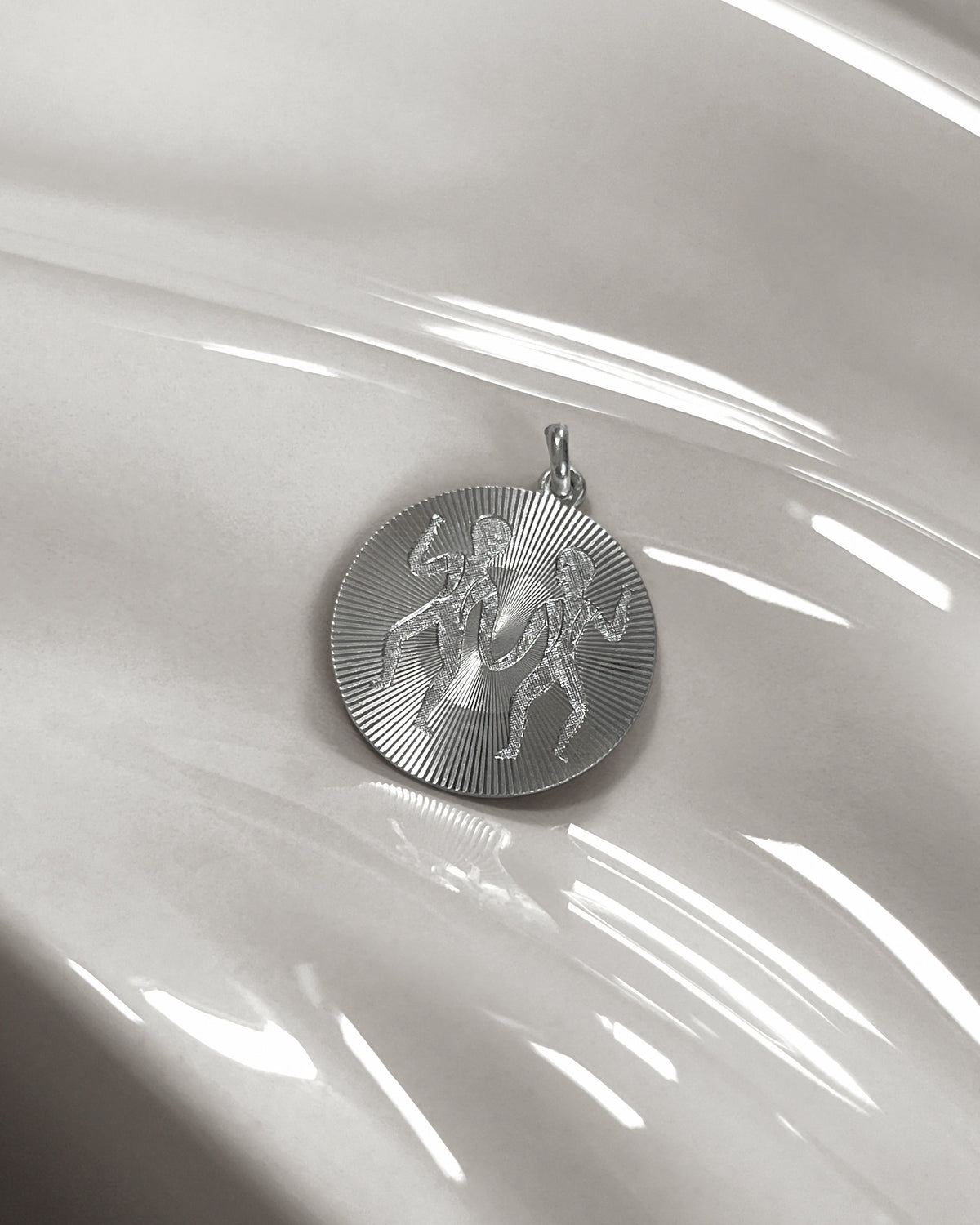 Vintage engine-turned Gemini pendant