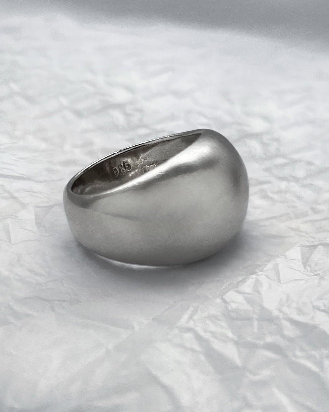 Side view of 1990s minimalist dome ring in sterling silver showing sculptural domed profile and polished finish – Auric Vintage