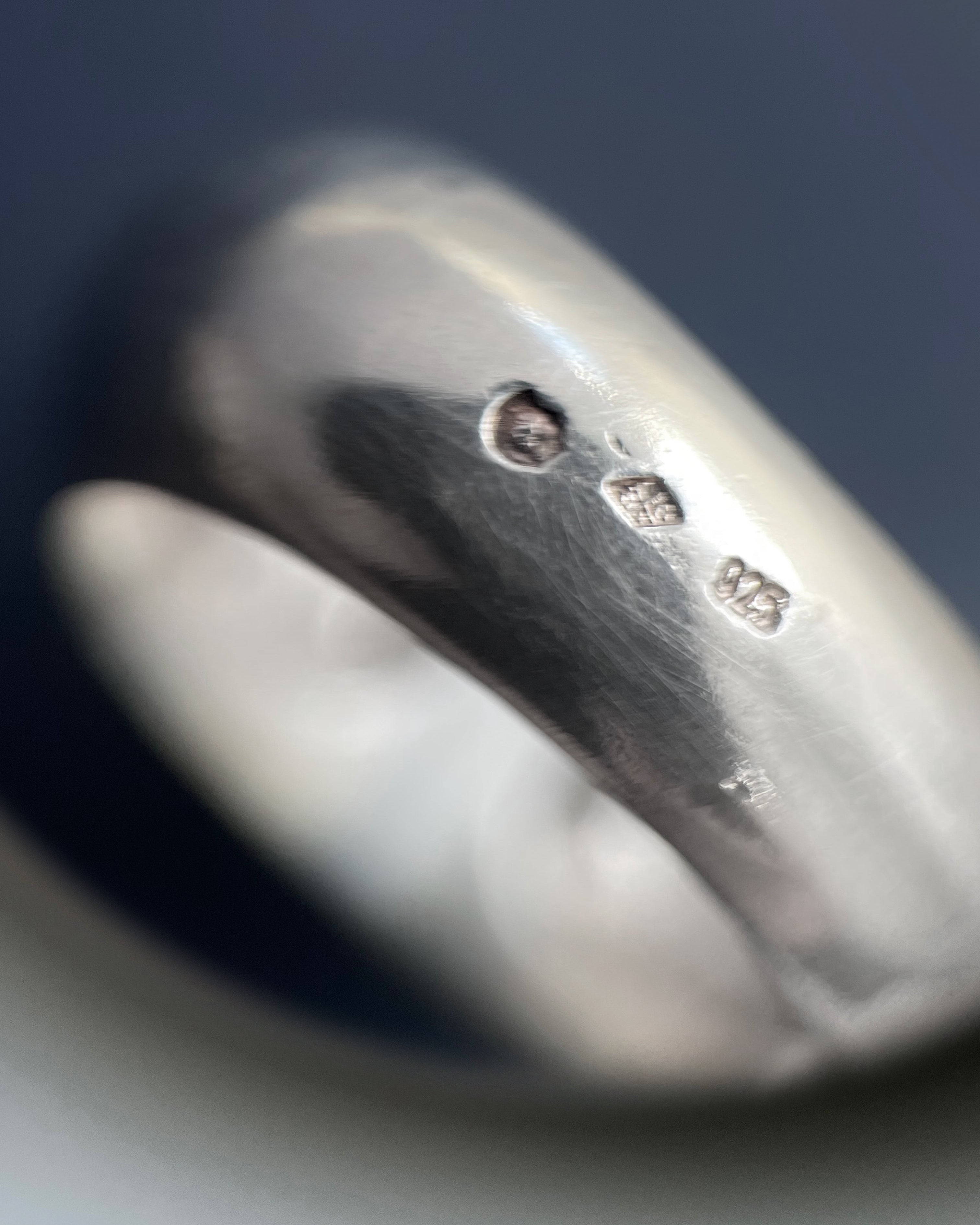 Close-up of French modernist heart ring in sterling silver showing Minerva hallmark and maker’s mark – Auric Vintage”