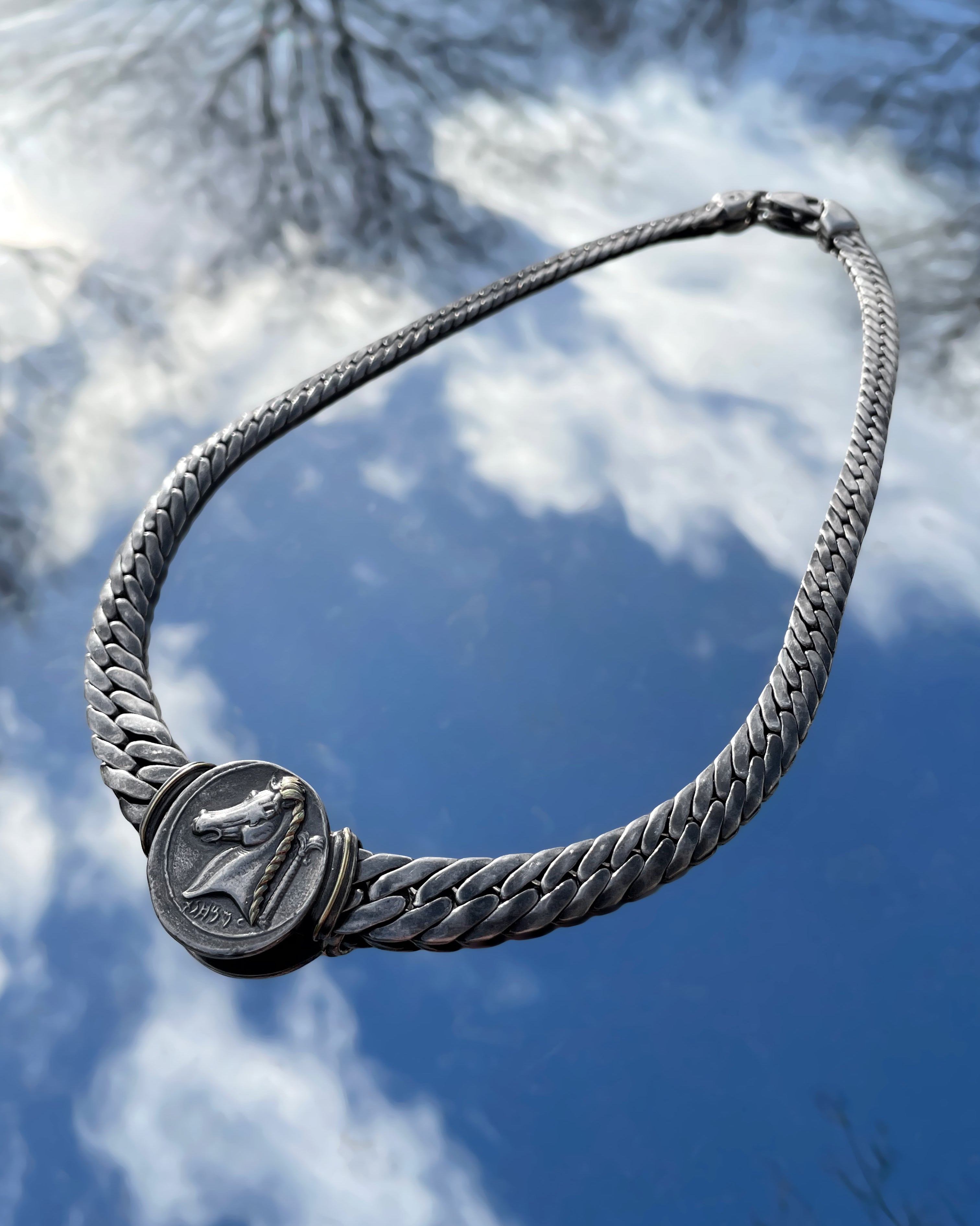 Top view of vintage French Carthaginian tetradrachm pendant collar necklace in sterling silver by Arthus Bertrand – Auric Vintage