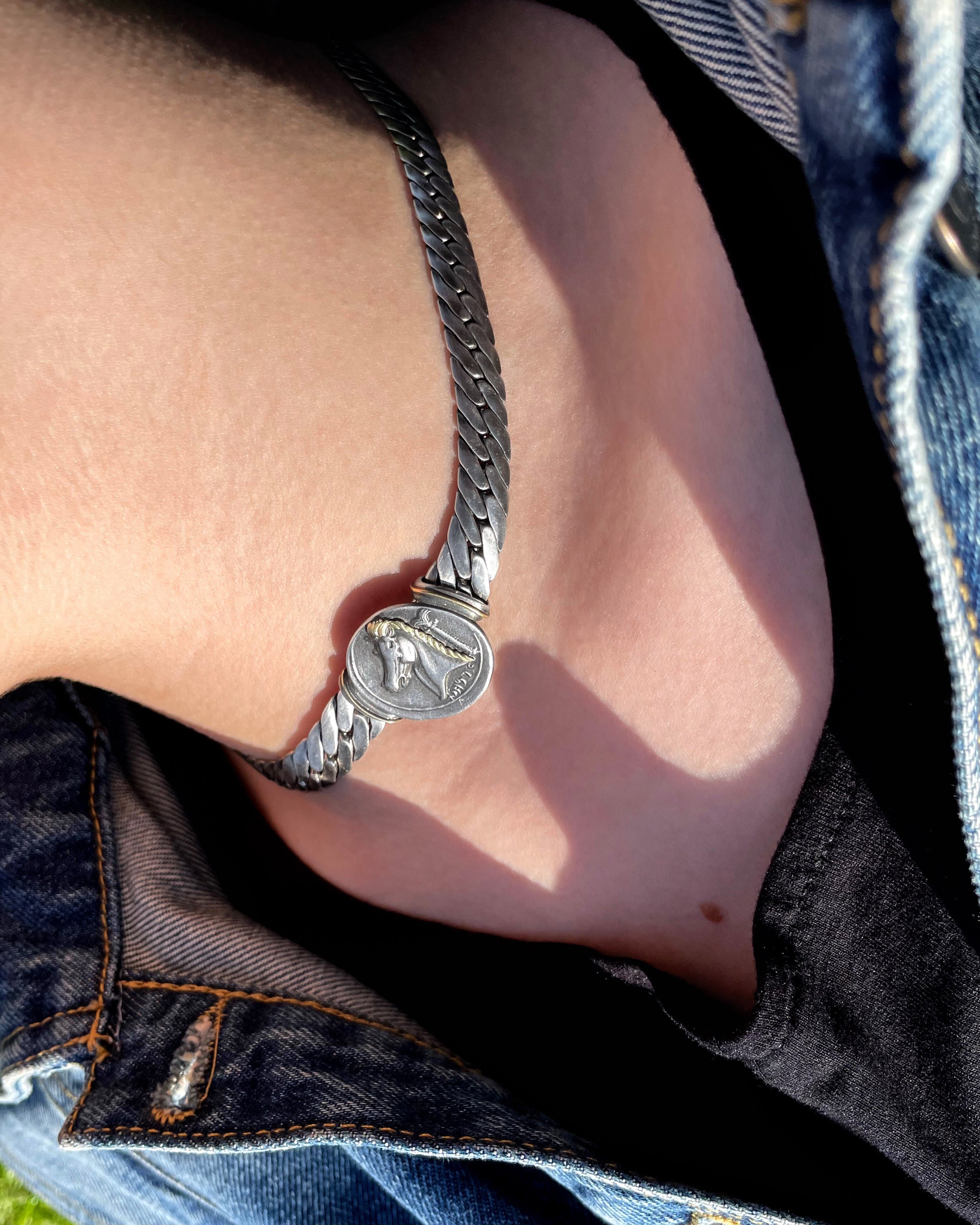 Vintage French Carthaginian tetradrachm pendant collar necklace in sterling silver by Arthus Bertrand worn on neck – Auric Vintage