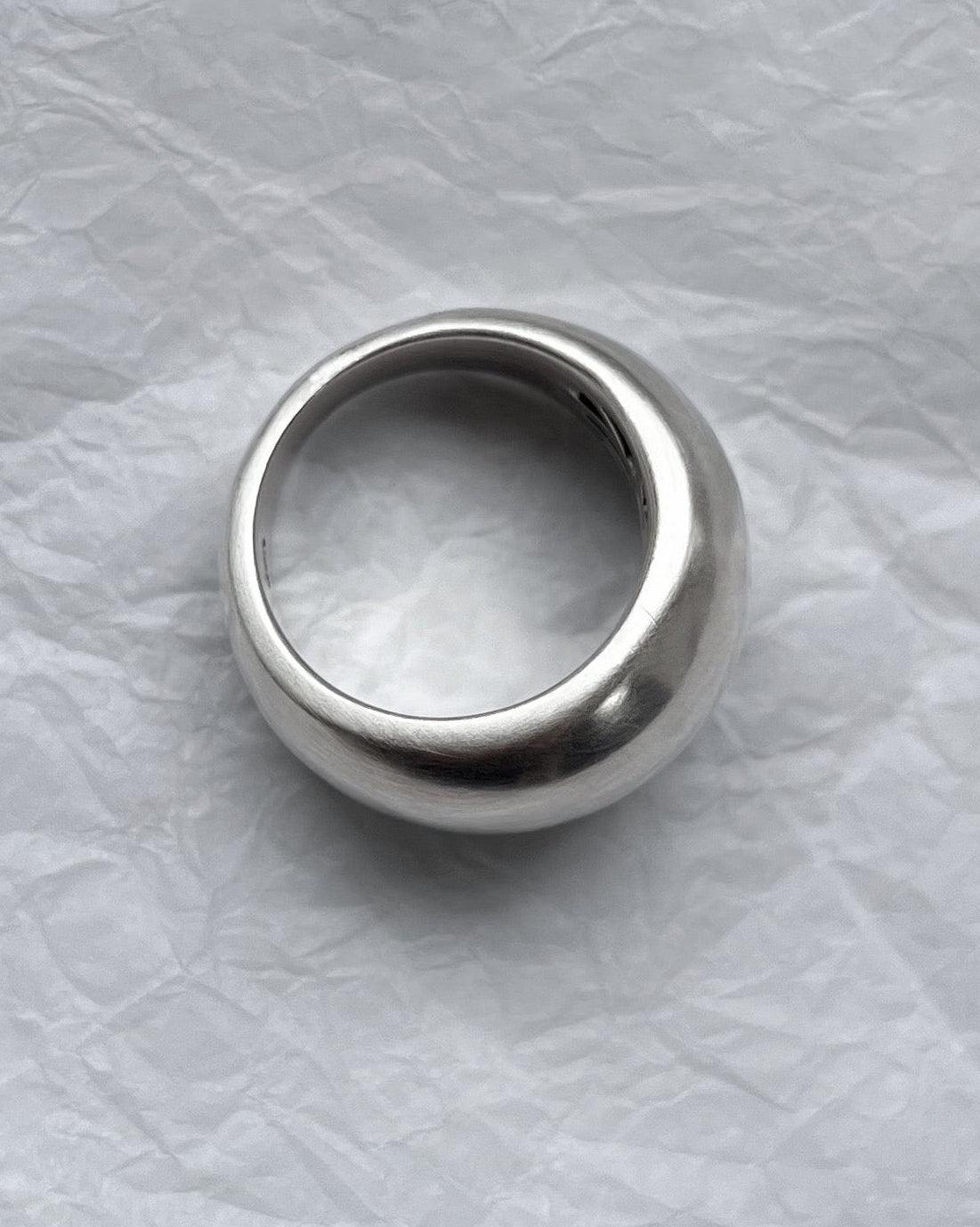 Birdseye view of sterling silver bombe ring showing domed shape and polished surface detail – Auric Vintage
