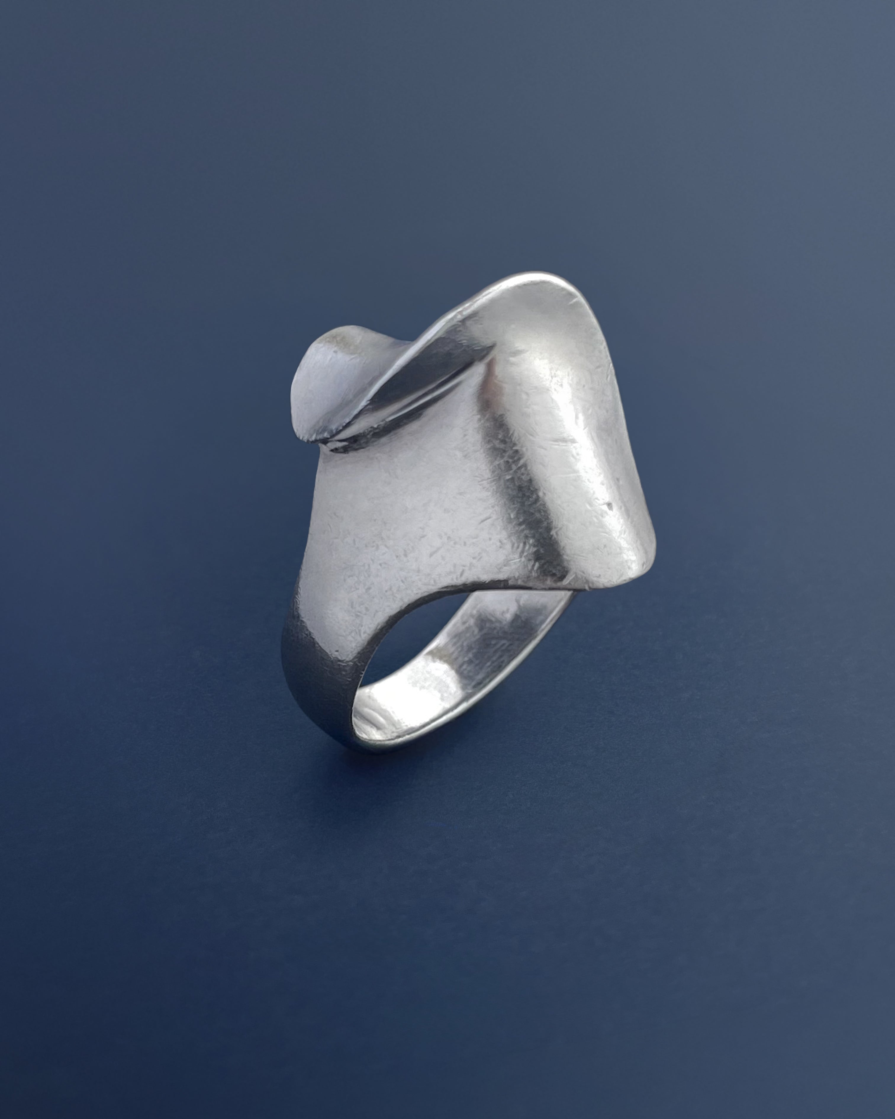 Side view of modernist French curvilinear ring in sterling silver showing sculptural folded profile – Auric Vintage