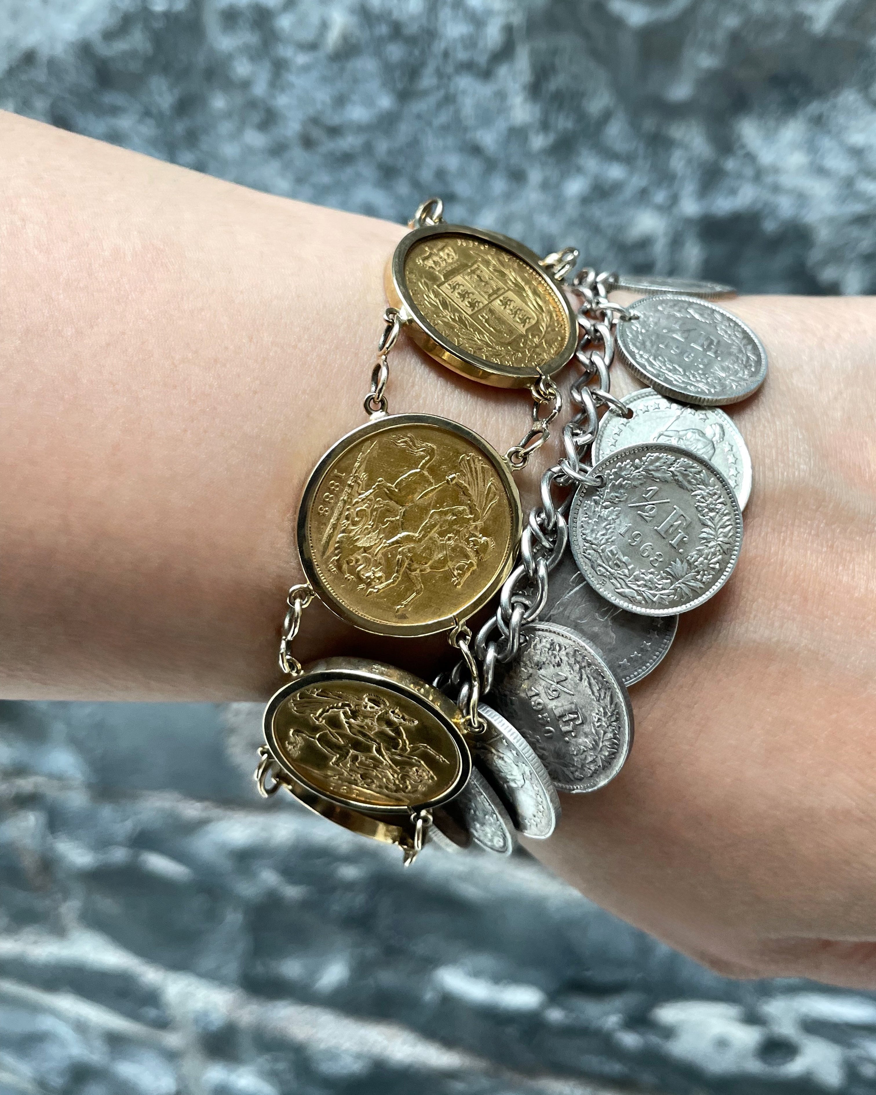 Vintage silver Swiss half-franc coin bracelet stacked with gold sovereign bracelet on wrist – Auric Vintage