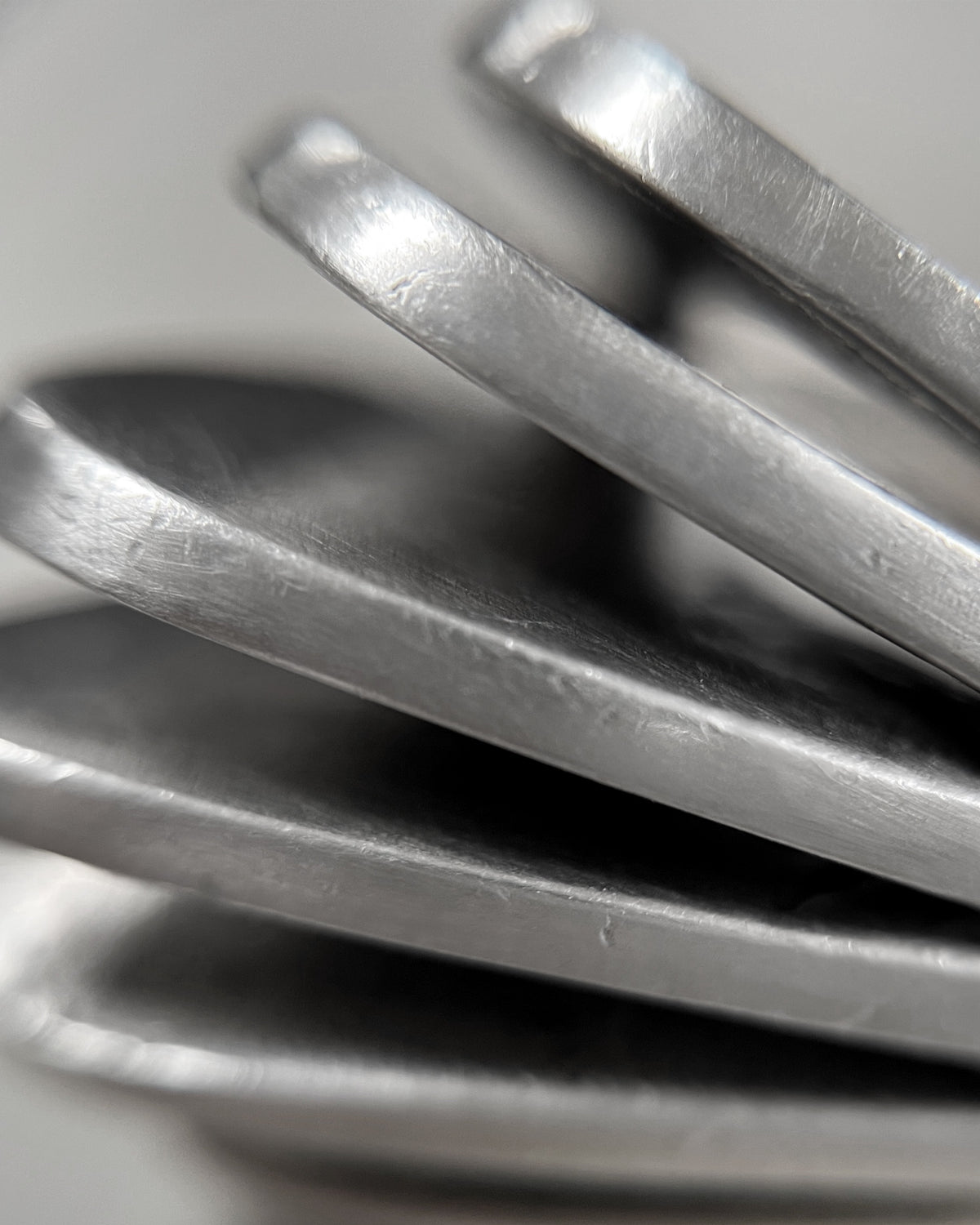 Magnified side view of a vintage Sterling silver statement ring showing the curved, graduating open ridges and integrated shoulders.