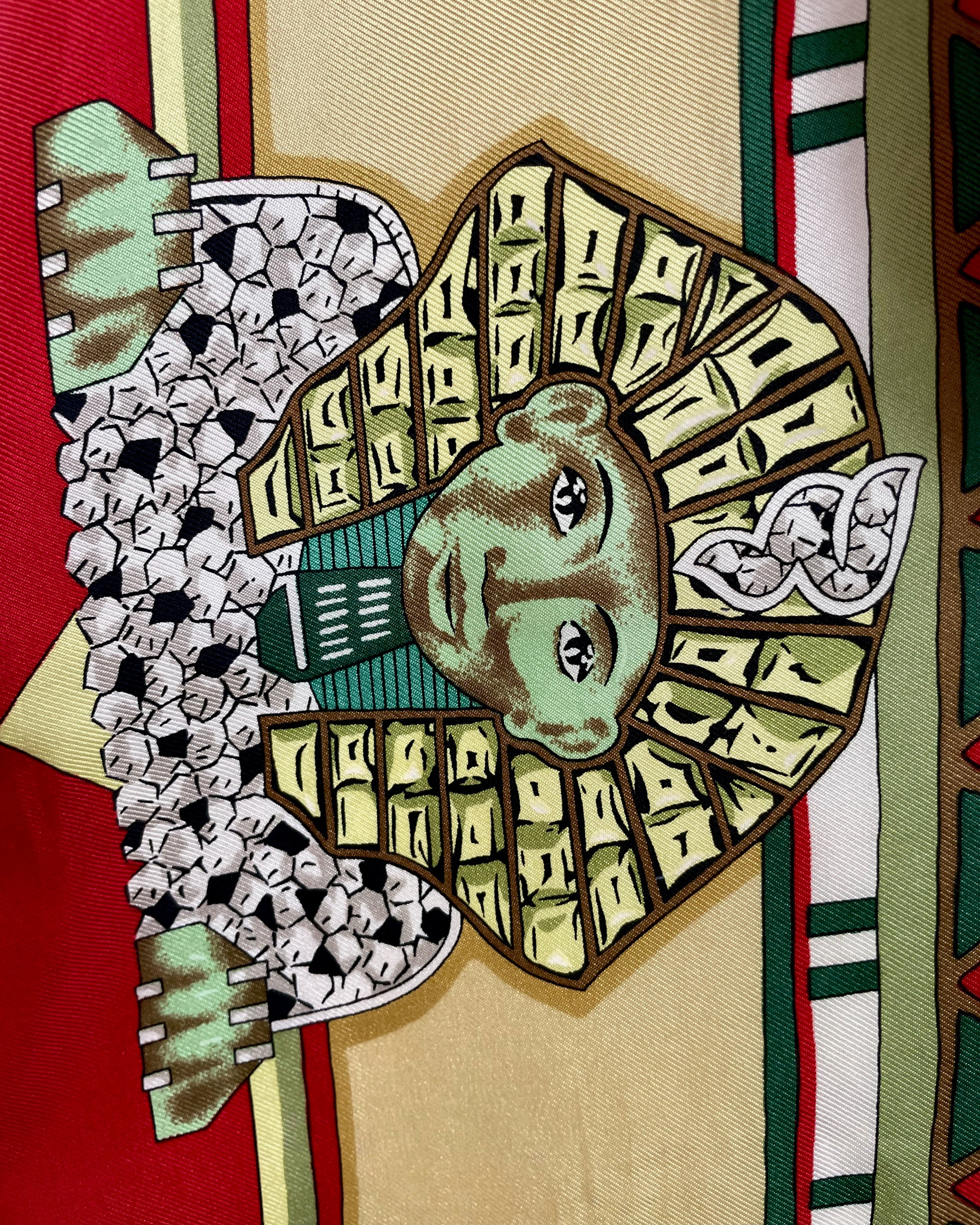 Close-up of Sphinx motif on vintage light green Must de Cartier Le Scarabée silk scarf – Auric Vintage
