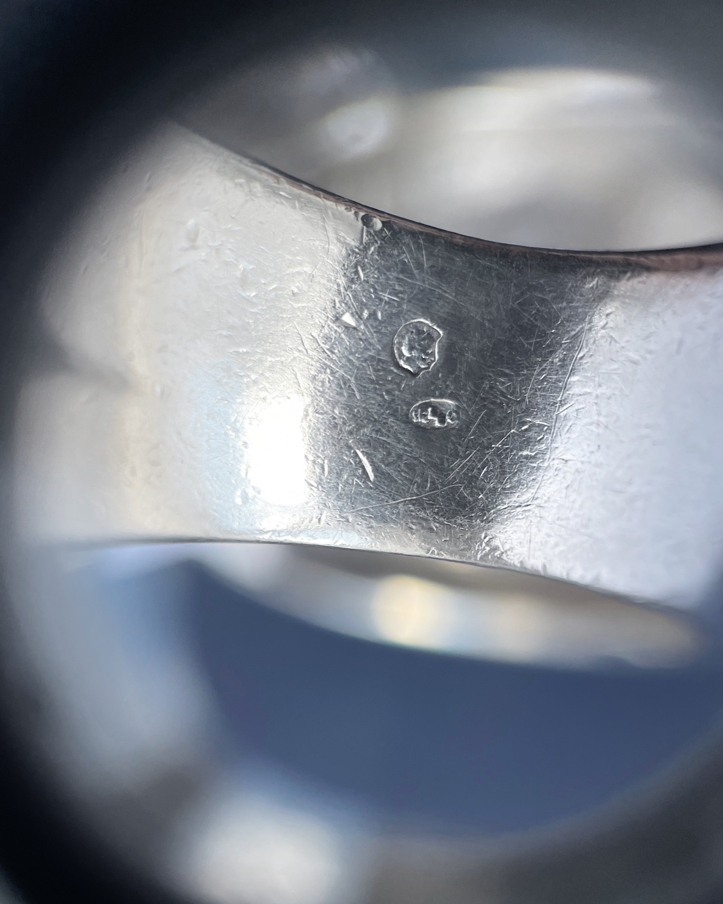 Close-up of 1970s French chunky crossover ring showing Minerva hallmark and maker’s mark – Auric Vintage