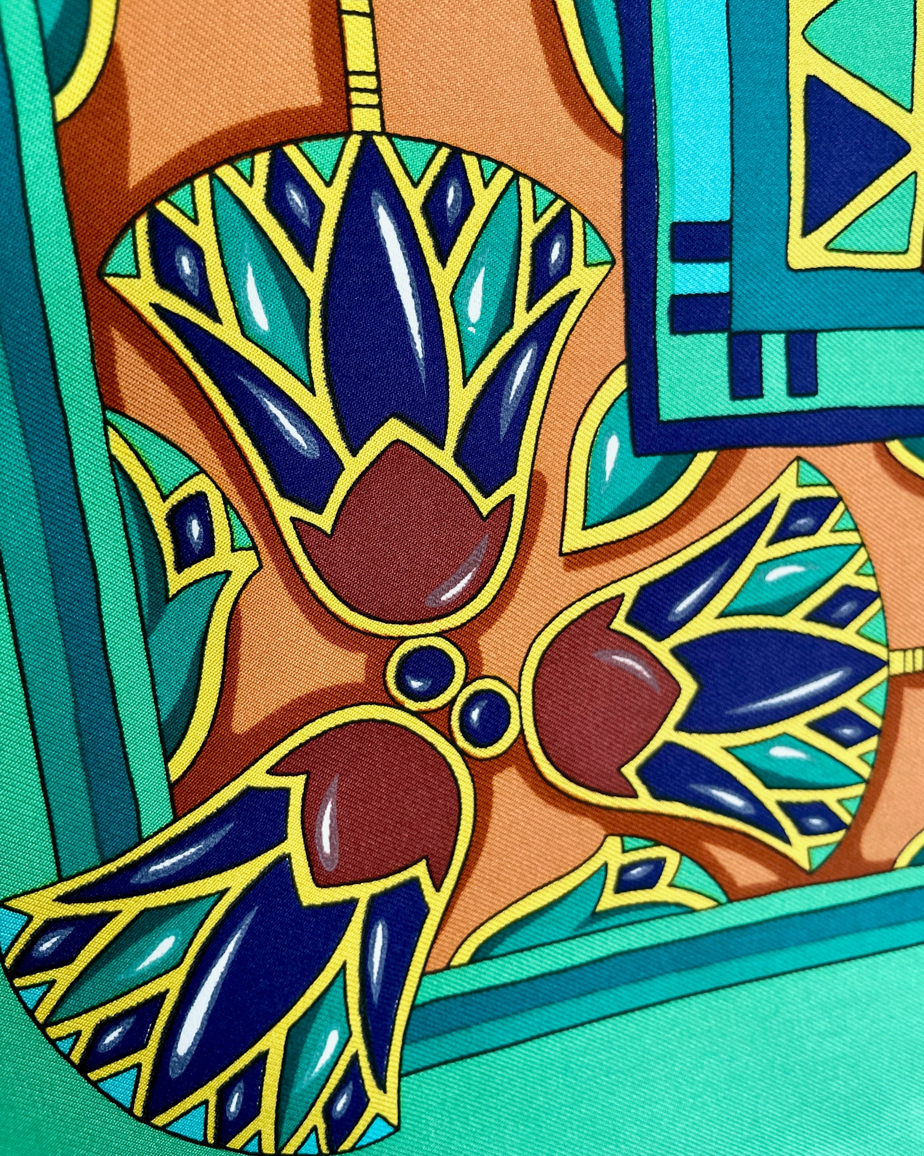 Close-up of lotus flower border on vintage dark green Must de Cartier Le Scarabée silk scarf – Auric Vintage