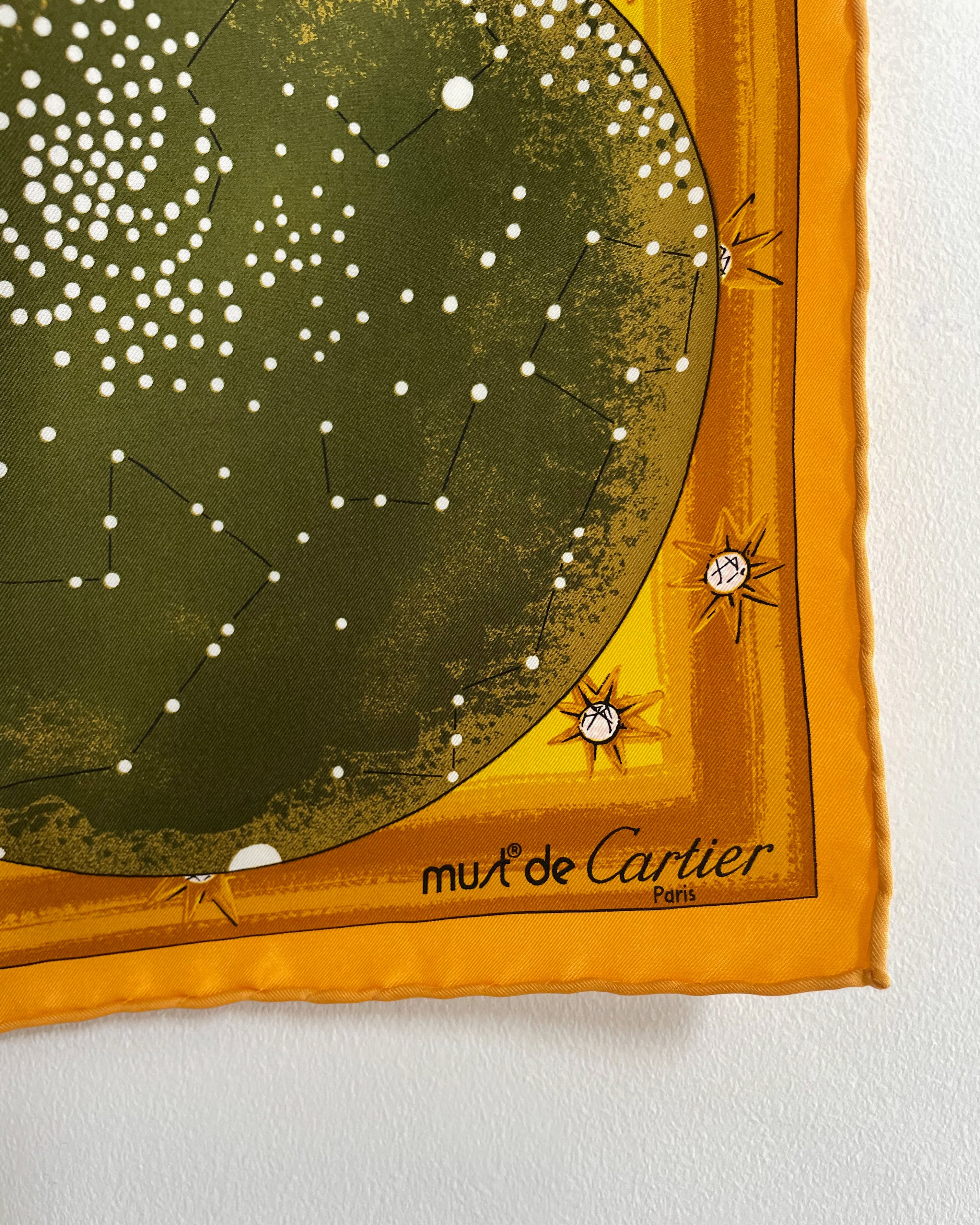 Close-up of vintage Must de Cartier silk scarf showing Must de Cartier signature – Auric Vintage