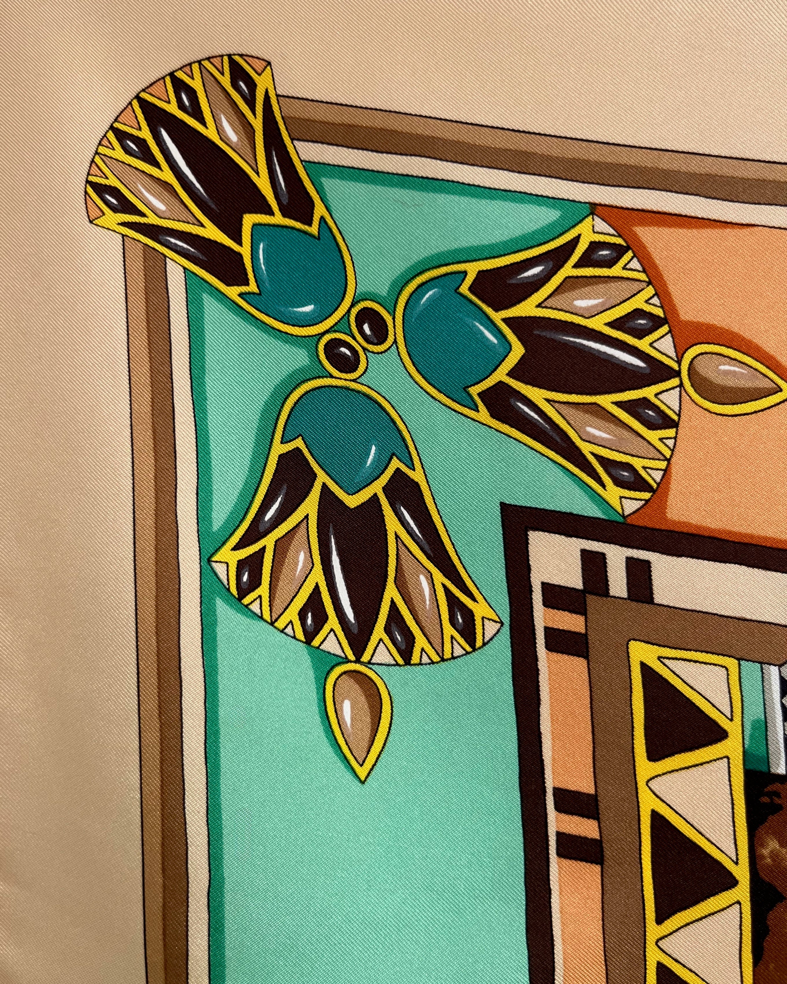 Close-up of lotus flower border on vintage brown Must de Cartier Le Scarabée silk scarf – Auric Vintage