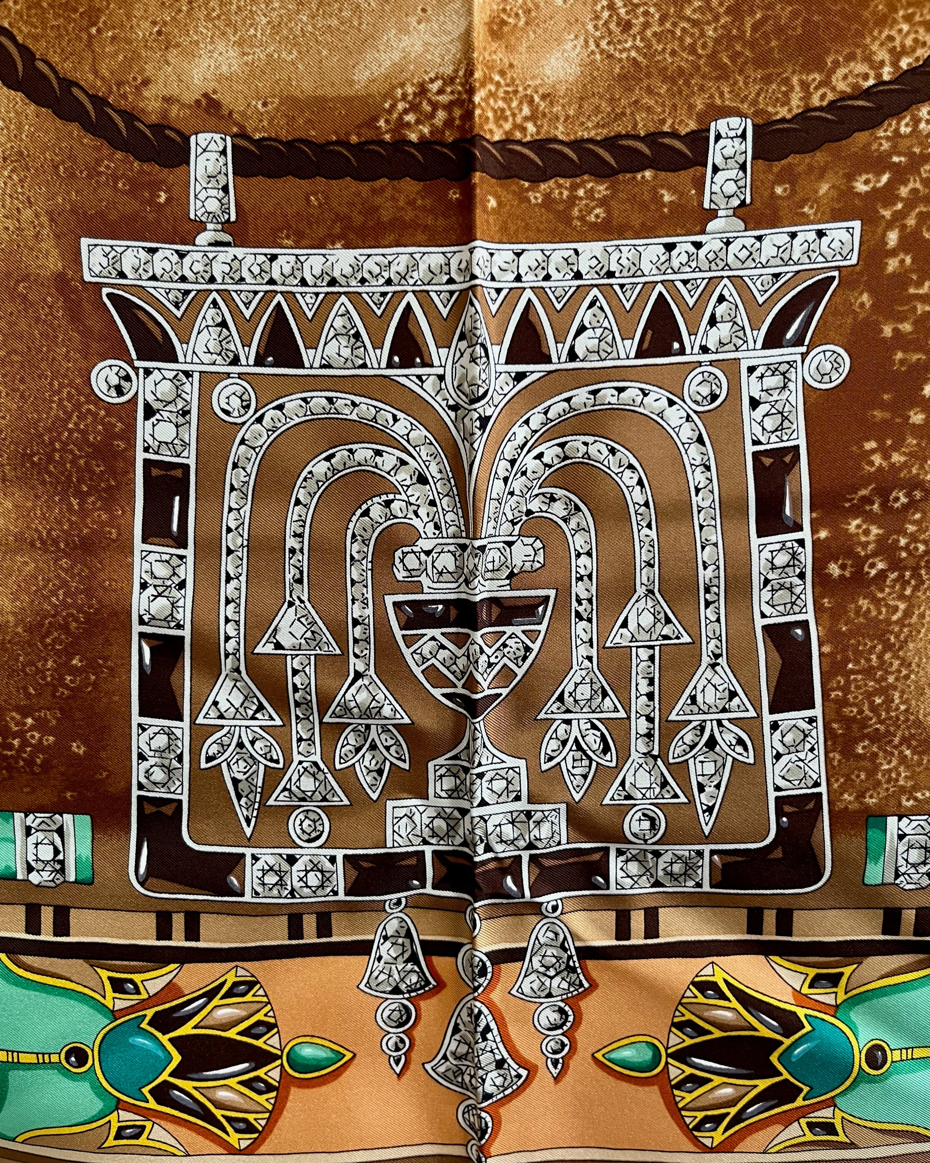 Close-up of Egyptian Pendant motif on vintage brown Must de Cartier Le Scarabée silk scarf – Auric Vintage