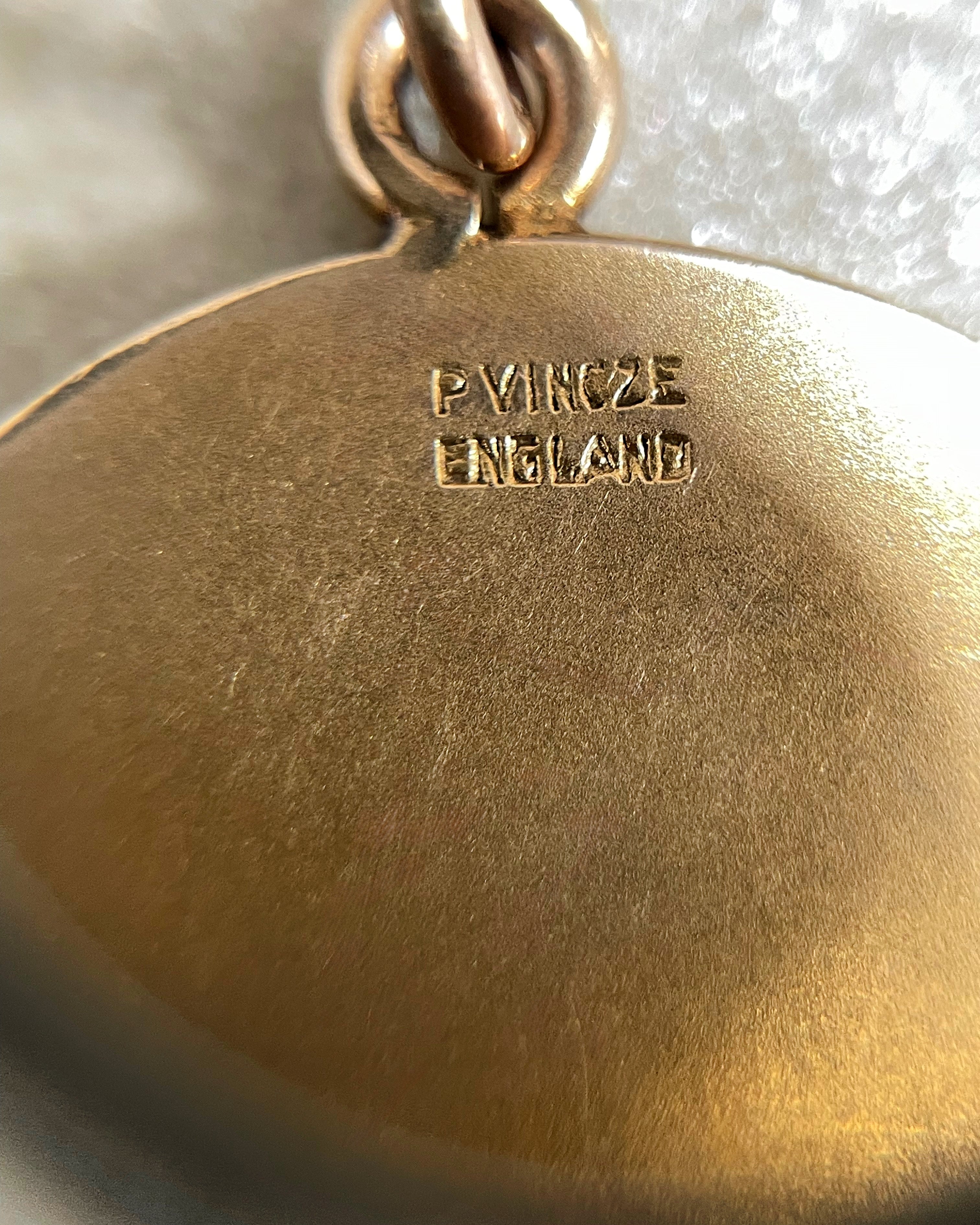 Close-up of P. Vincze England signature on vintage 9kt gold St. Christopher medal – Auric Vintage