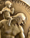 Close-up of vintage Paul Vincze 9kt gold St. Christopher medal showing sculpted relief – Auric Vintage