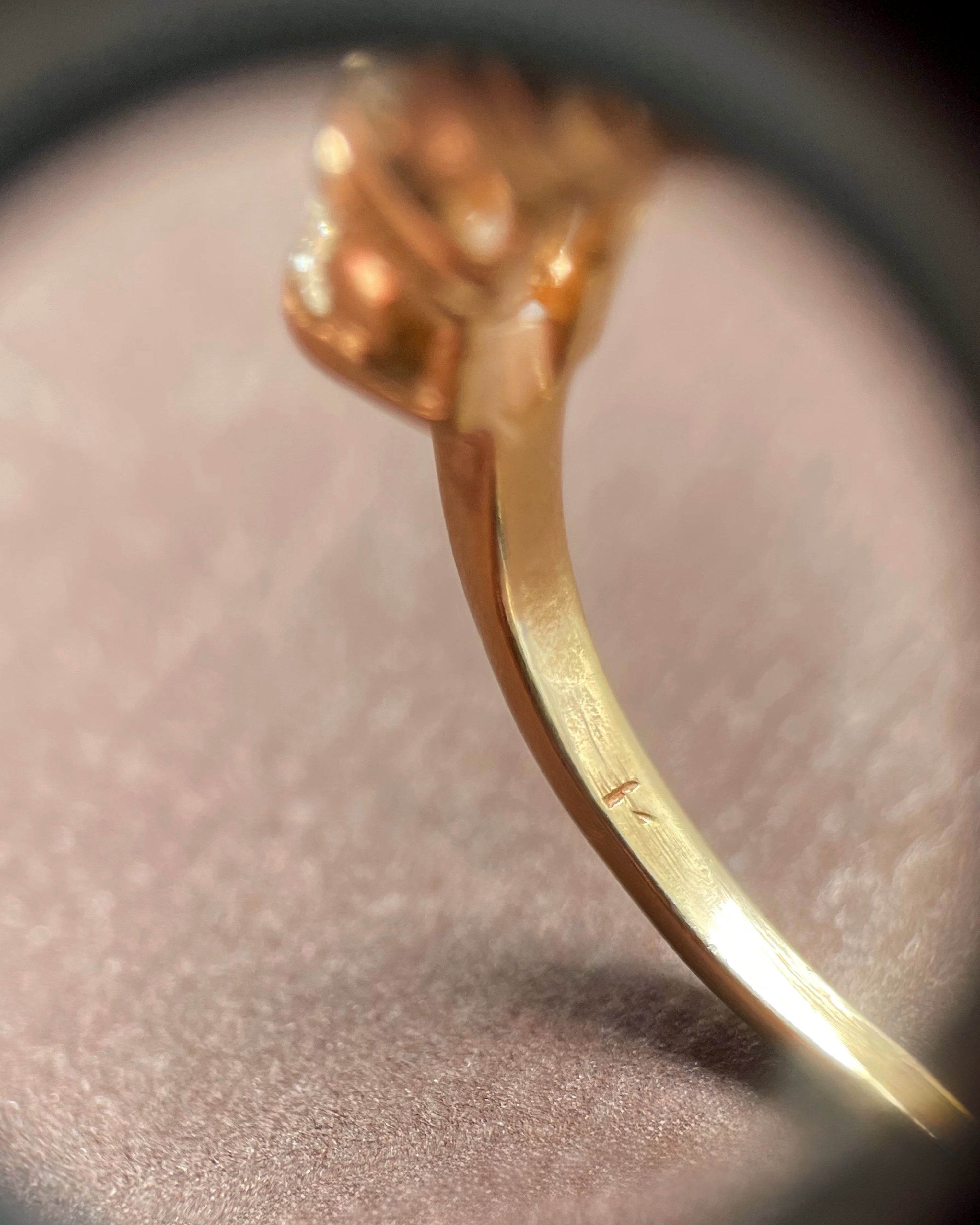 Close-up of noughties 14kt yellow gold diamond ring showing gold hallmark inside shank – Auric Vintage