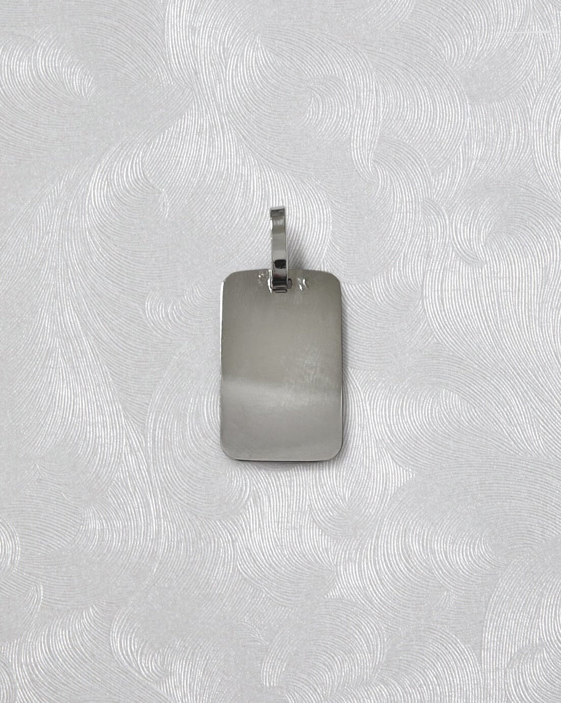 Reverse of 1990s French St. Christopher pendant in 18kt white gold showing smooth finish – Auric Vintage