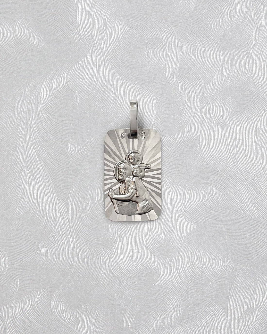 1990s French St. Christopher pendant in 18kt white gold with faceted radiating background – Auric Vintage