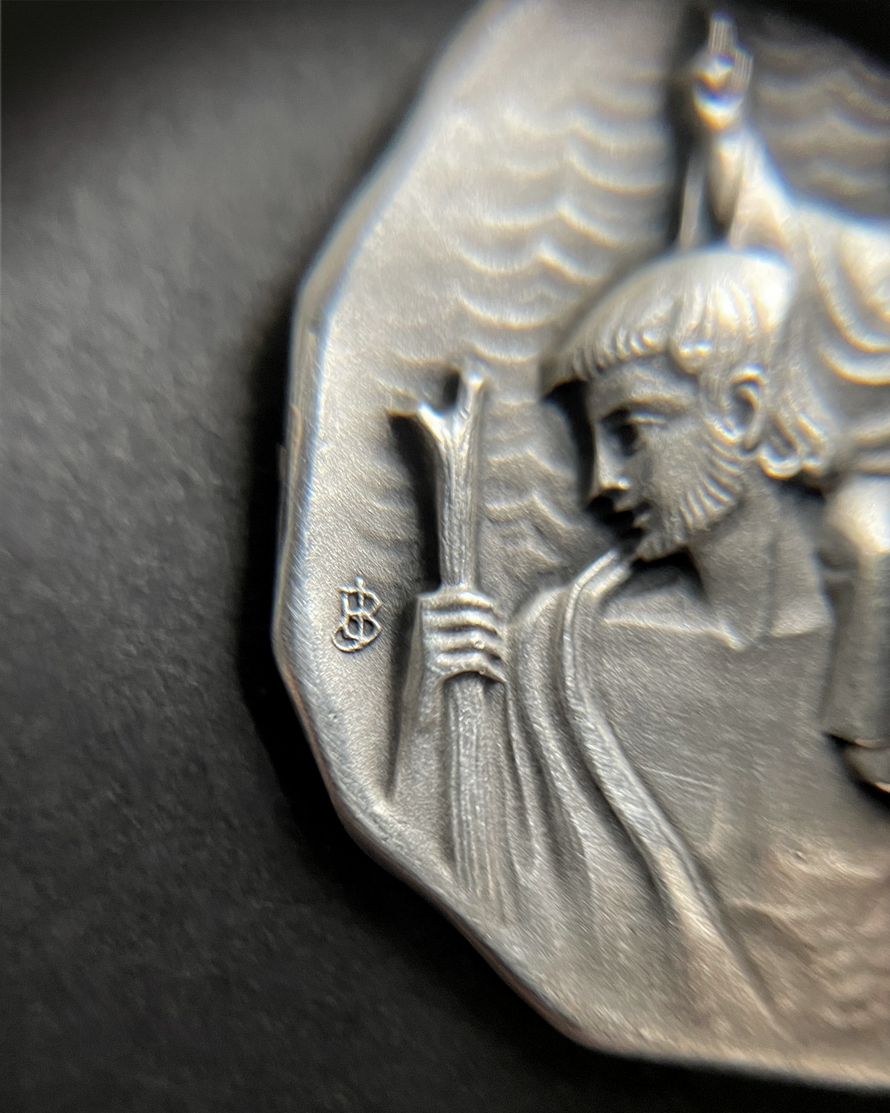 Close-up of mid century French 800 silver St. Christopher medal showing saint detail – Auric Vintage