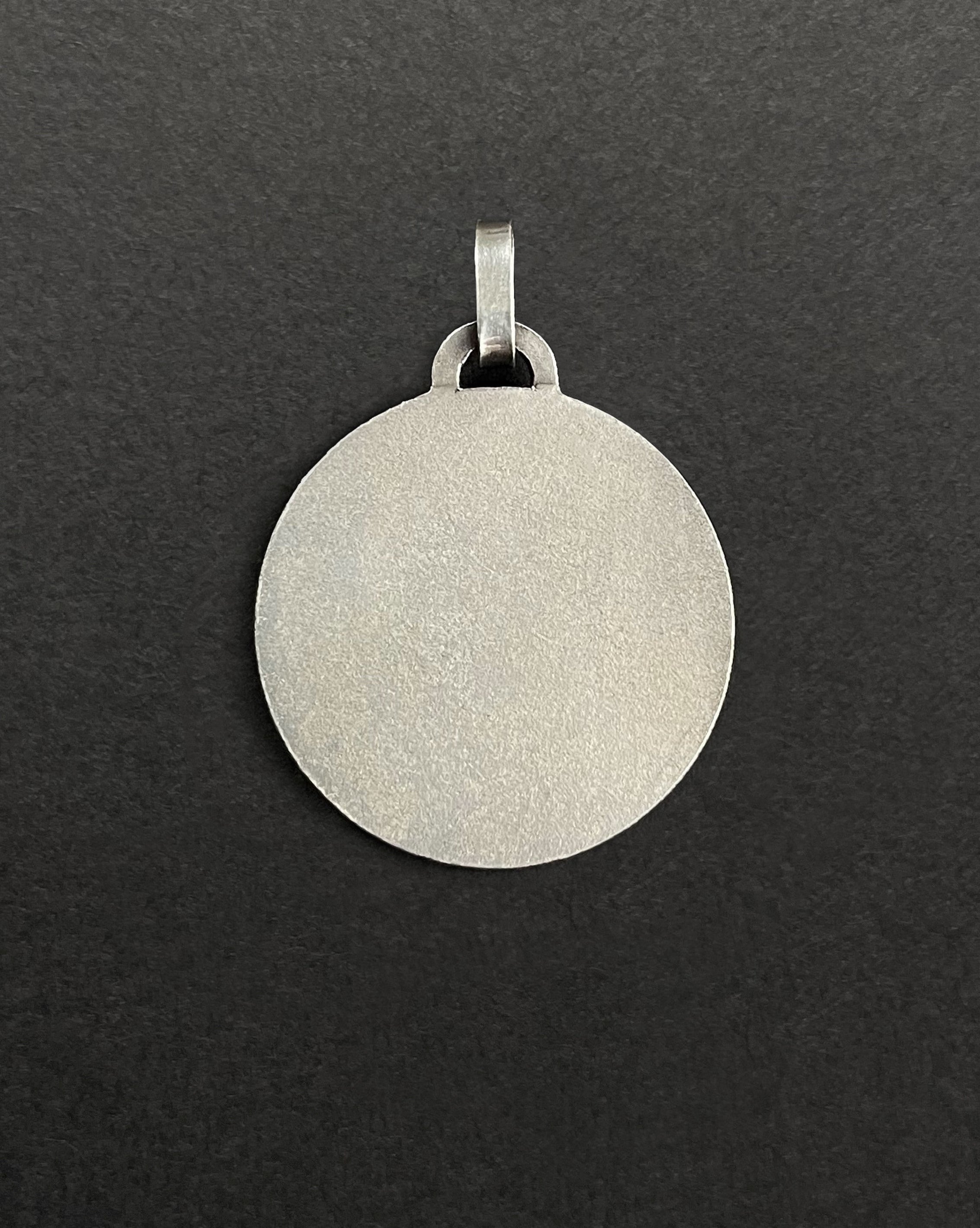 Reverse of 1970s French St. Christopher pendant in silver showing smooth finish – Auric Vintage