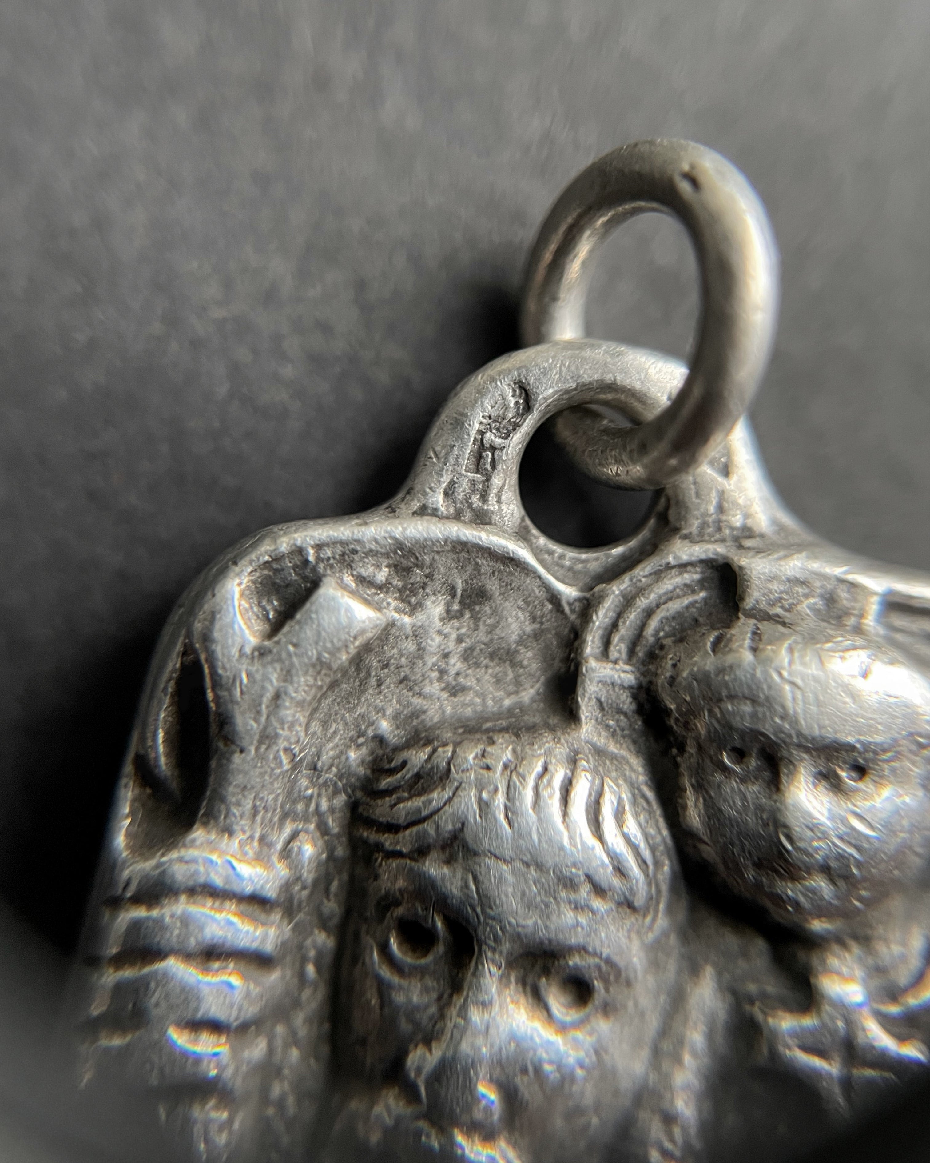 Close-up of 1960s French 800 silver St. Christopher pendant showing silver hallmark on bail – Auric Vintage